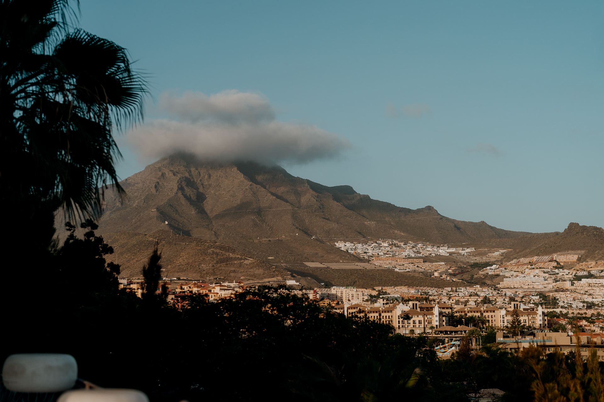 A town in front of a mountain