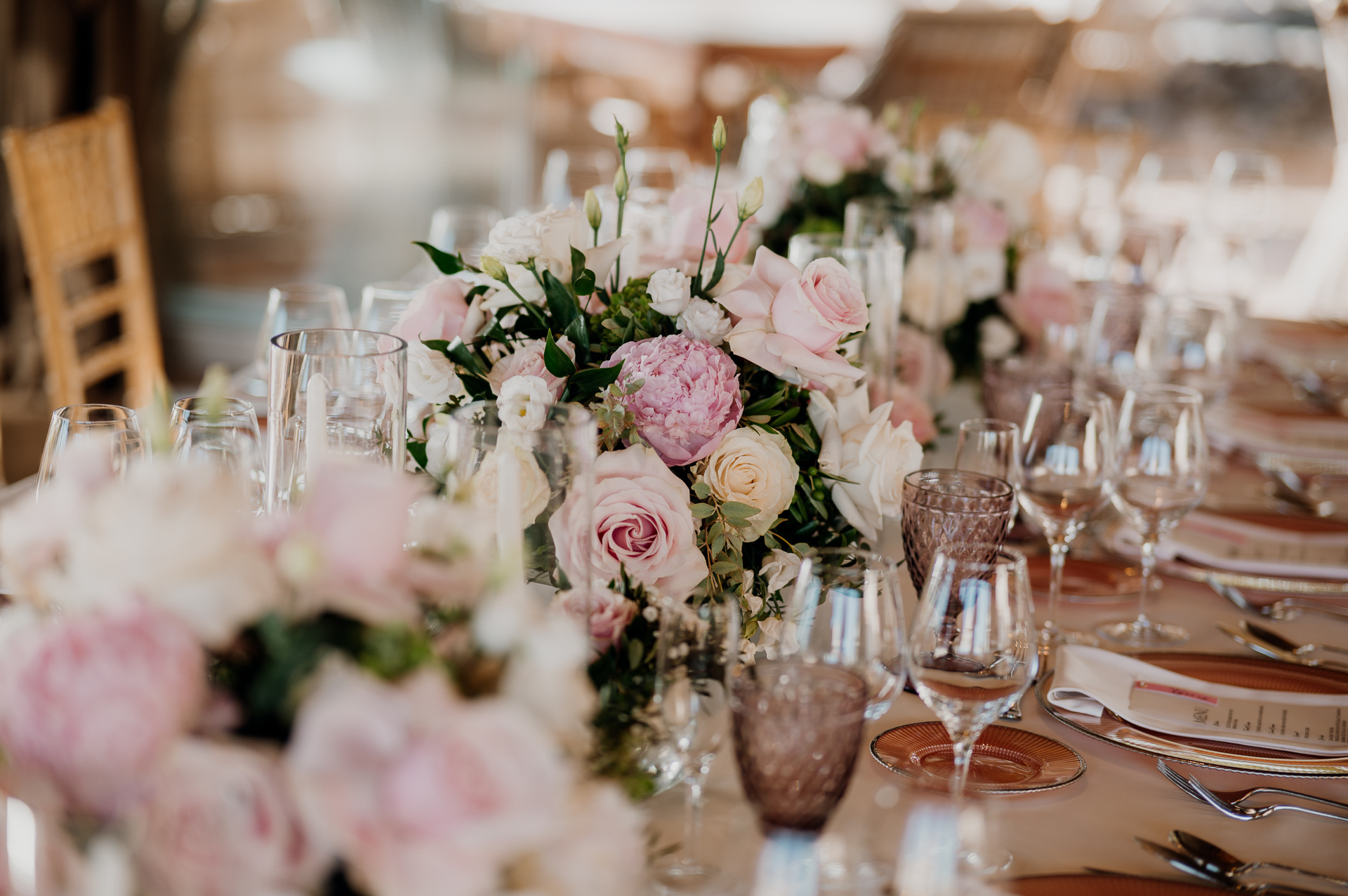 A table with flowers and glasses