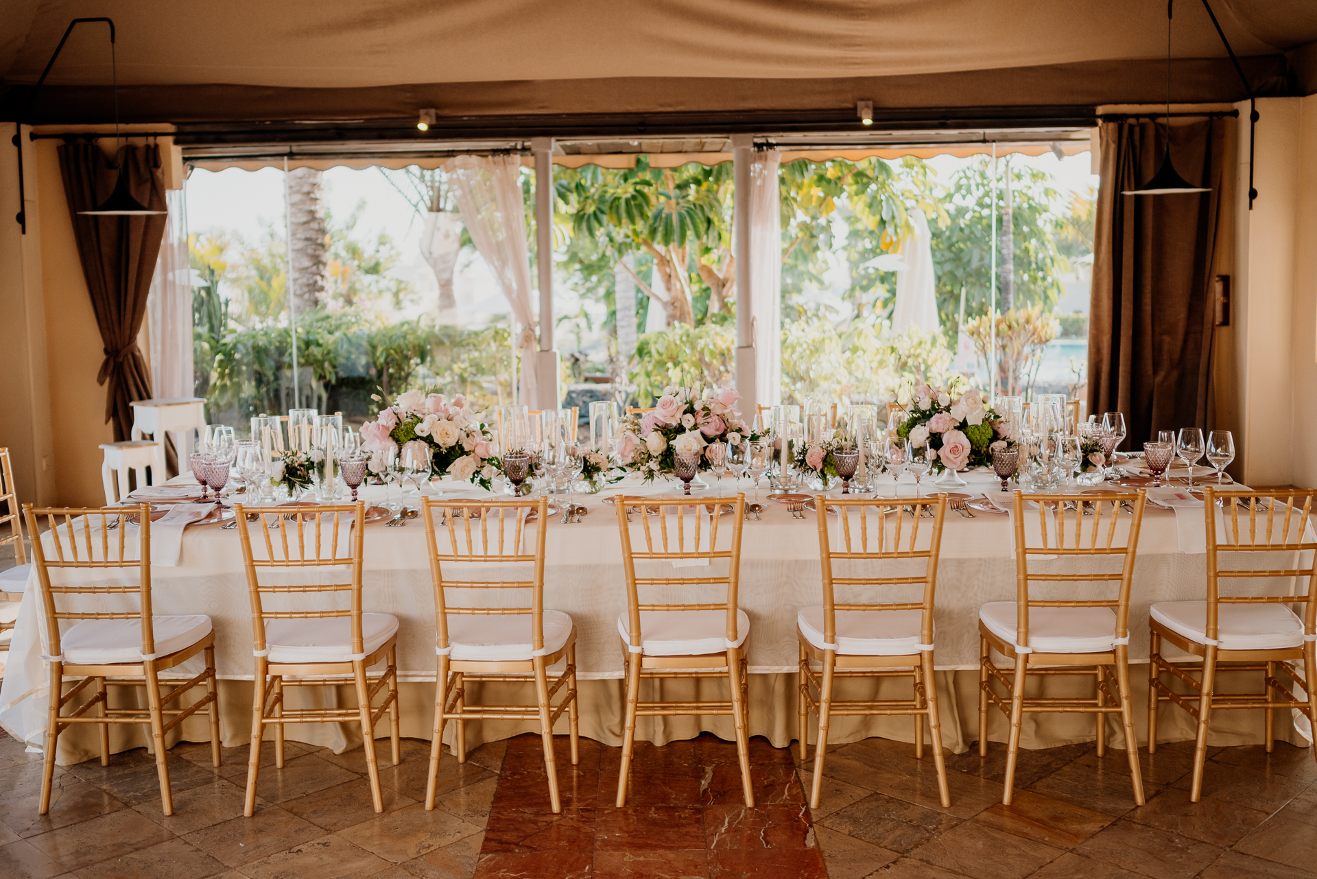 A dining room table with chairs around it