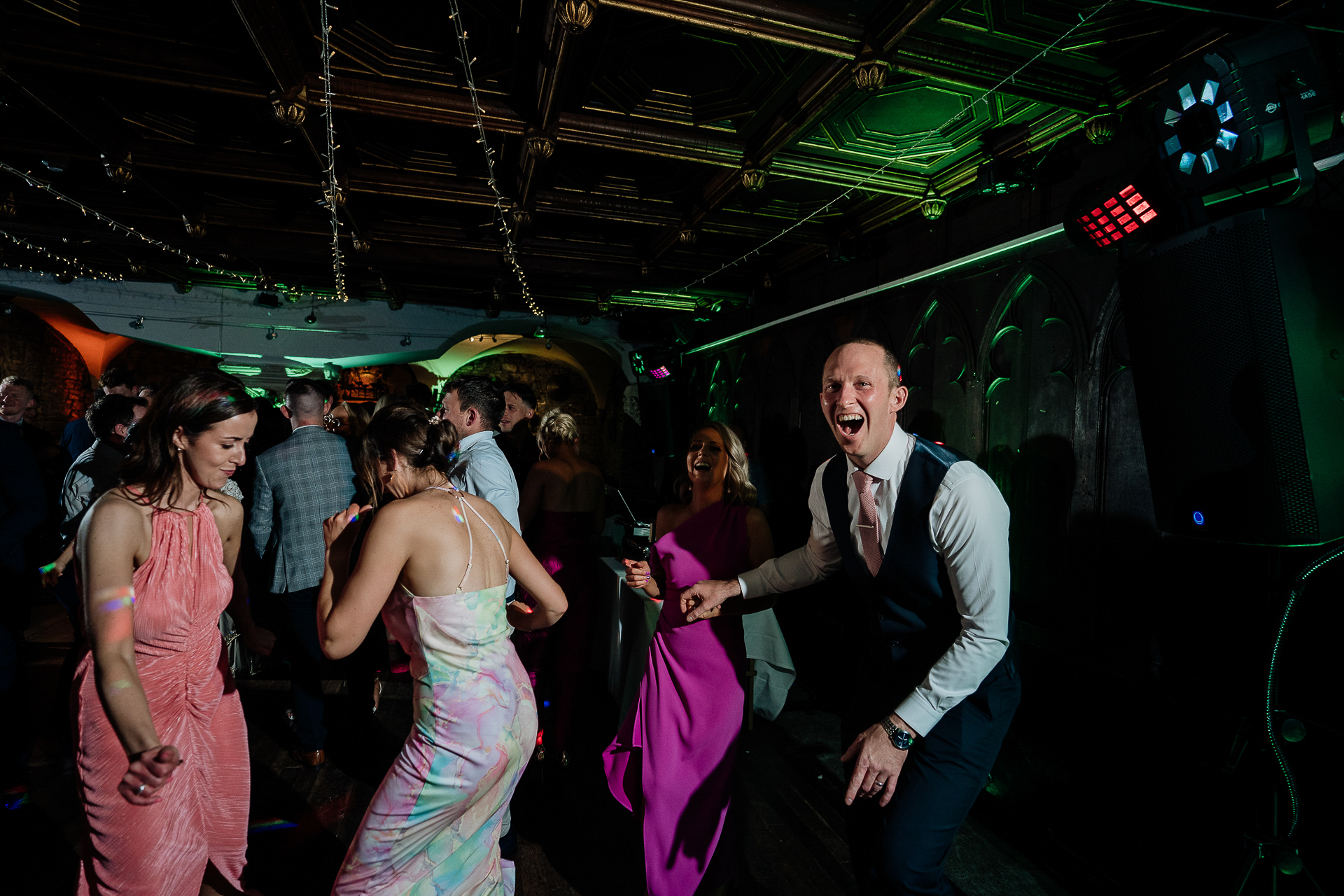 A person dancing with a group of women