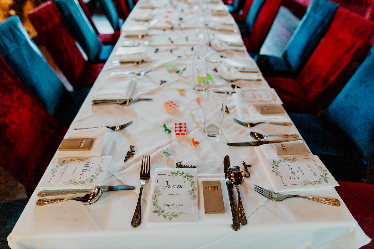 A table with a white tablecloth and silverware