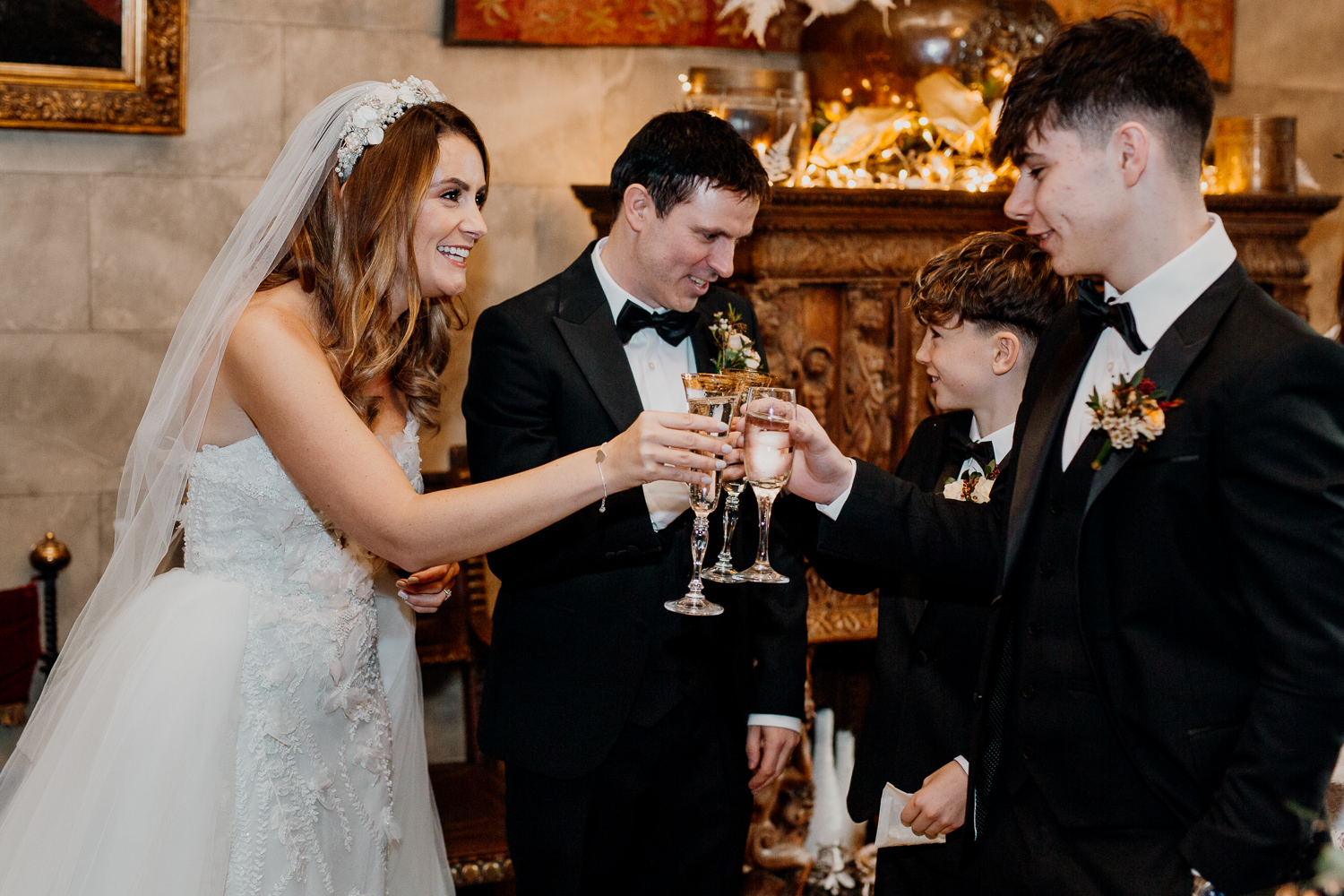 A group of people holding wine glasses