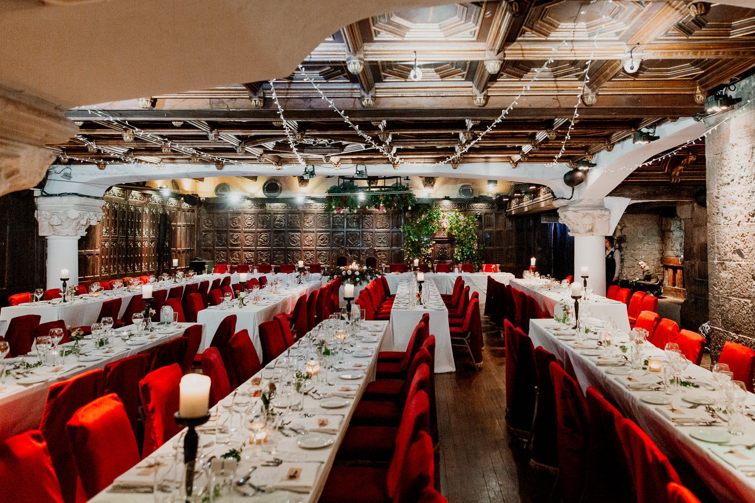 A large room with tables set for a meal