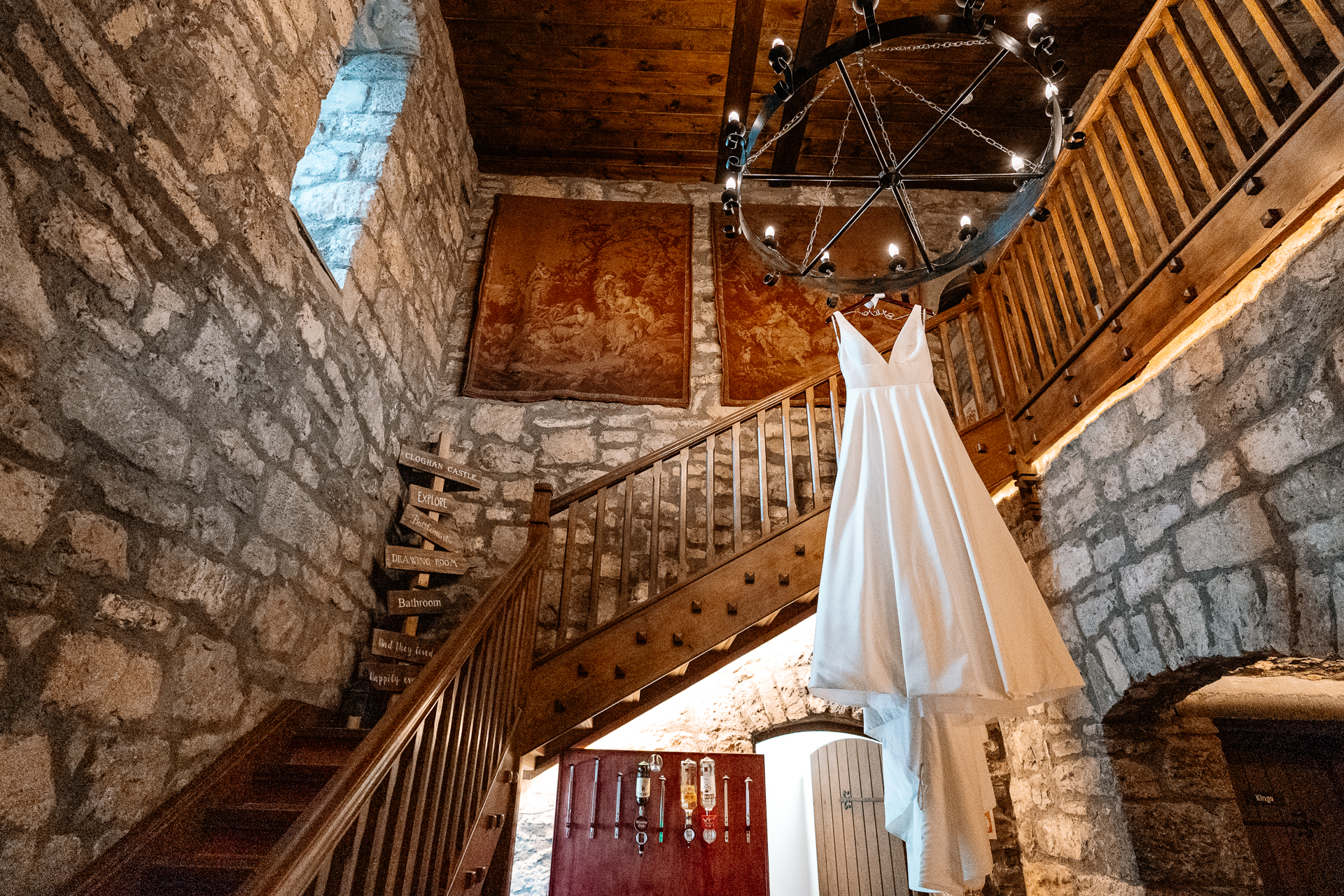 A staircase with a white cloth from the ceiling