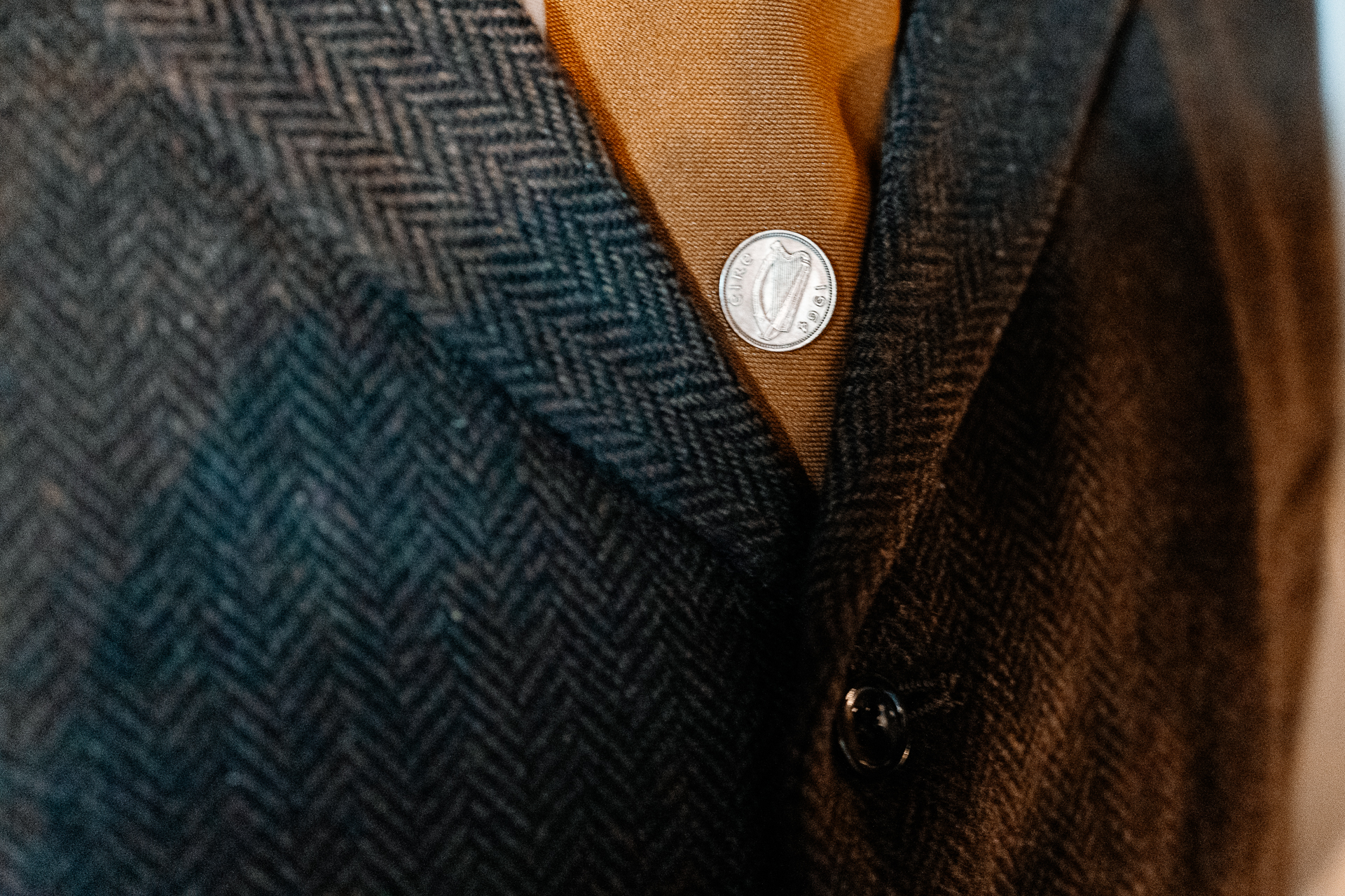 A close up of a man's shirt with a button