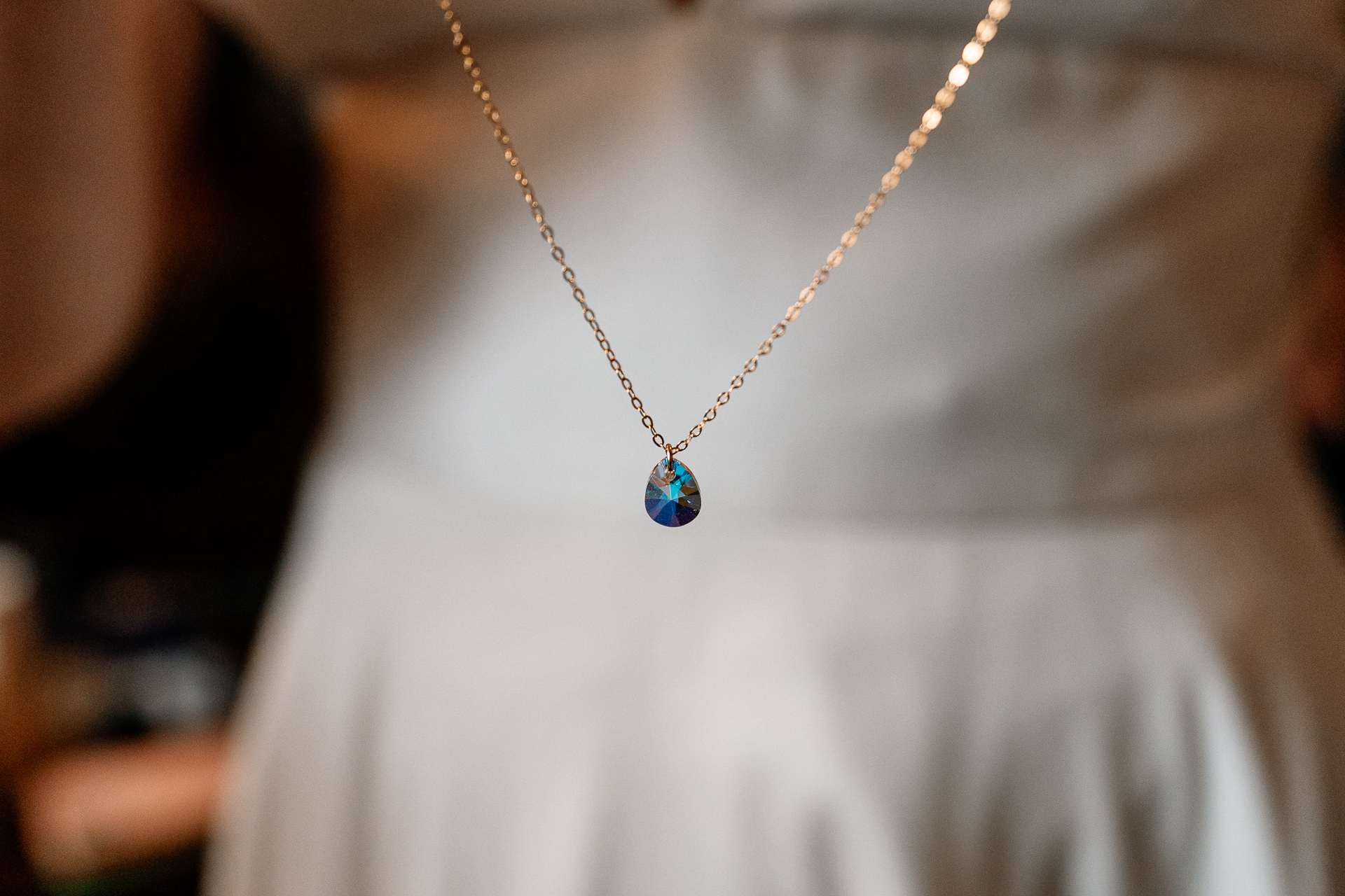 A necklace with a blue gem