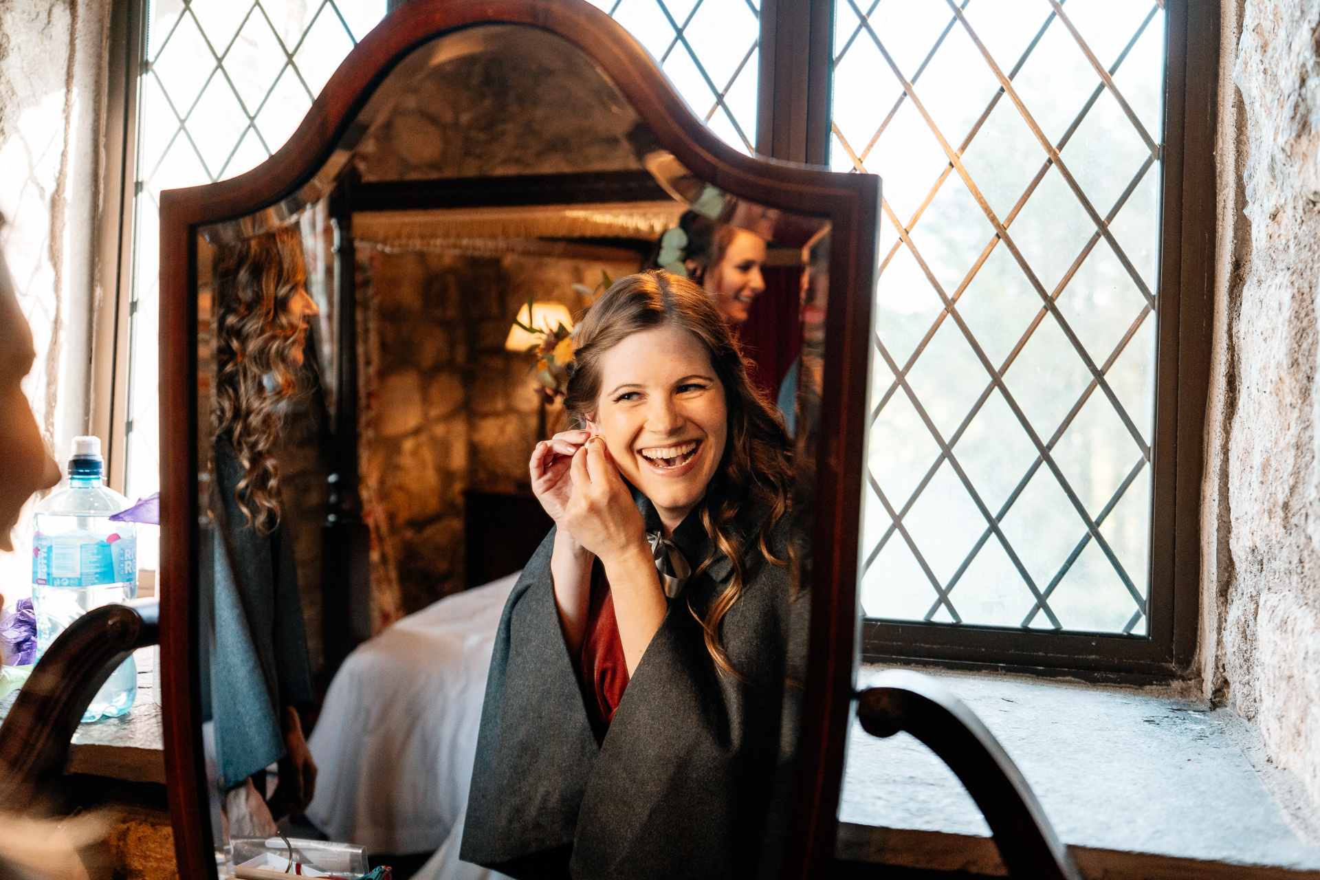 A woman smiling and sitting in a chair