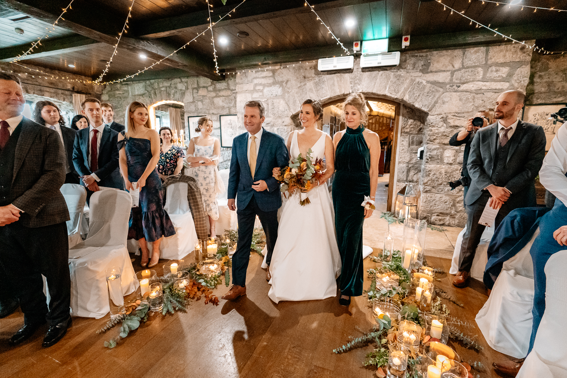 A group of people walking down a aisle