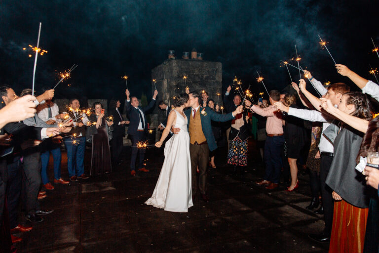 A group of people holding sparklers