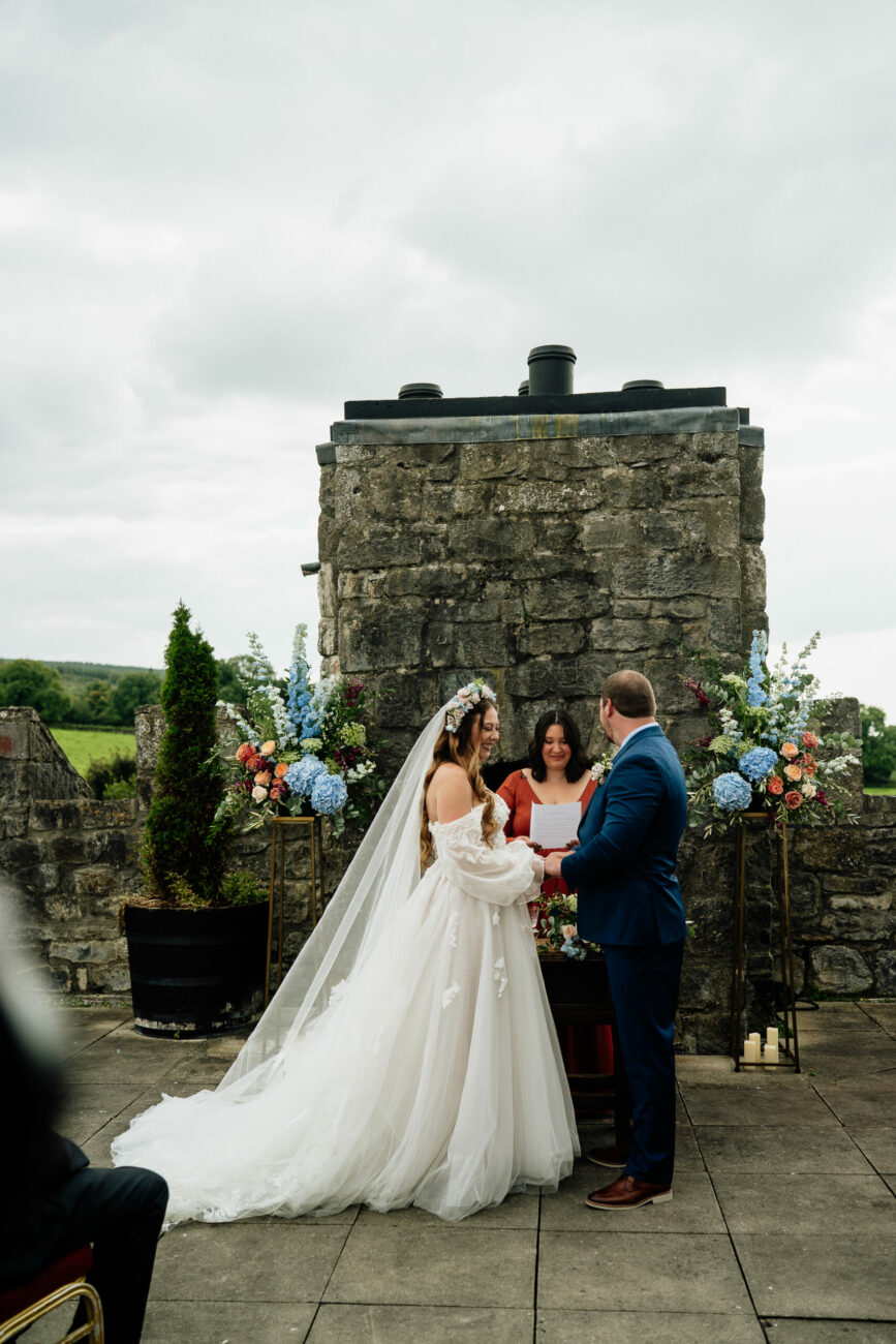 A bride and groom posing for a picture