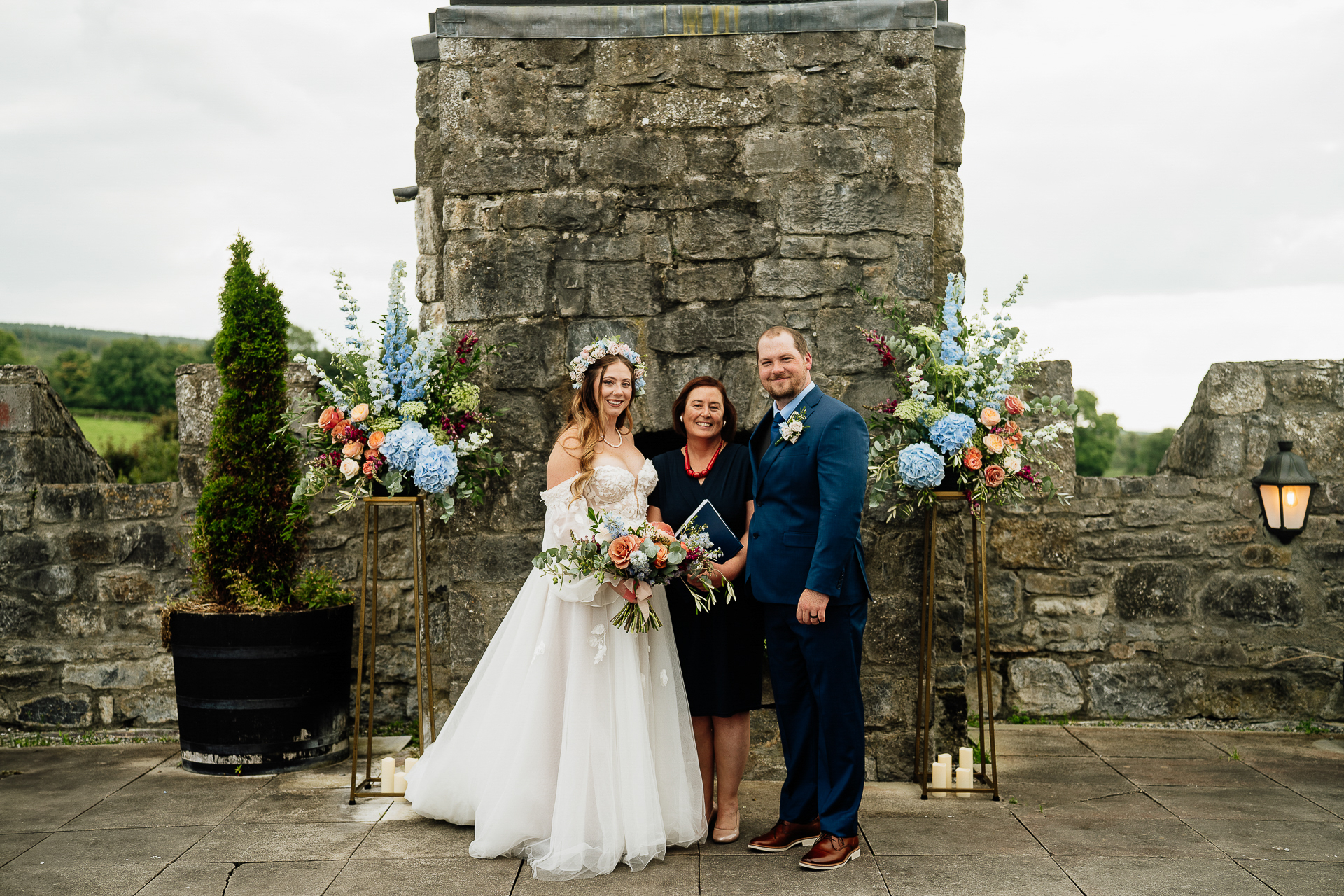 A bride and groom posing for a picture