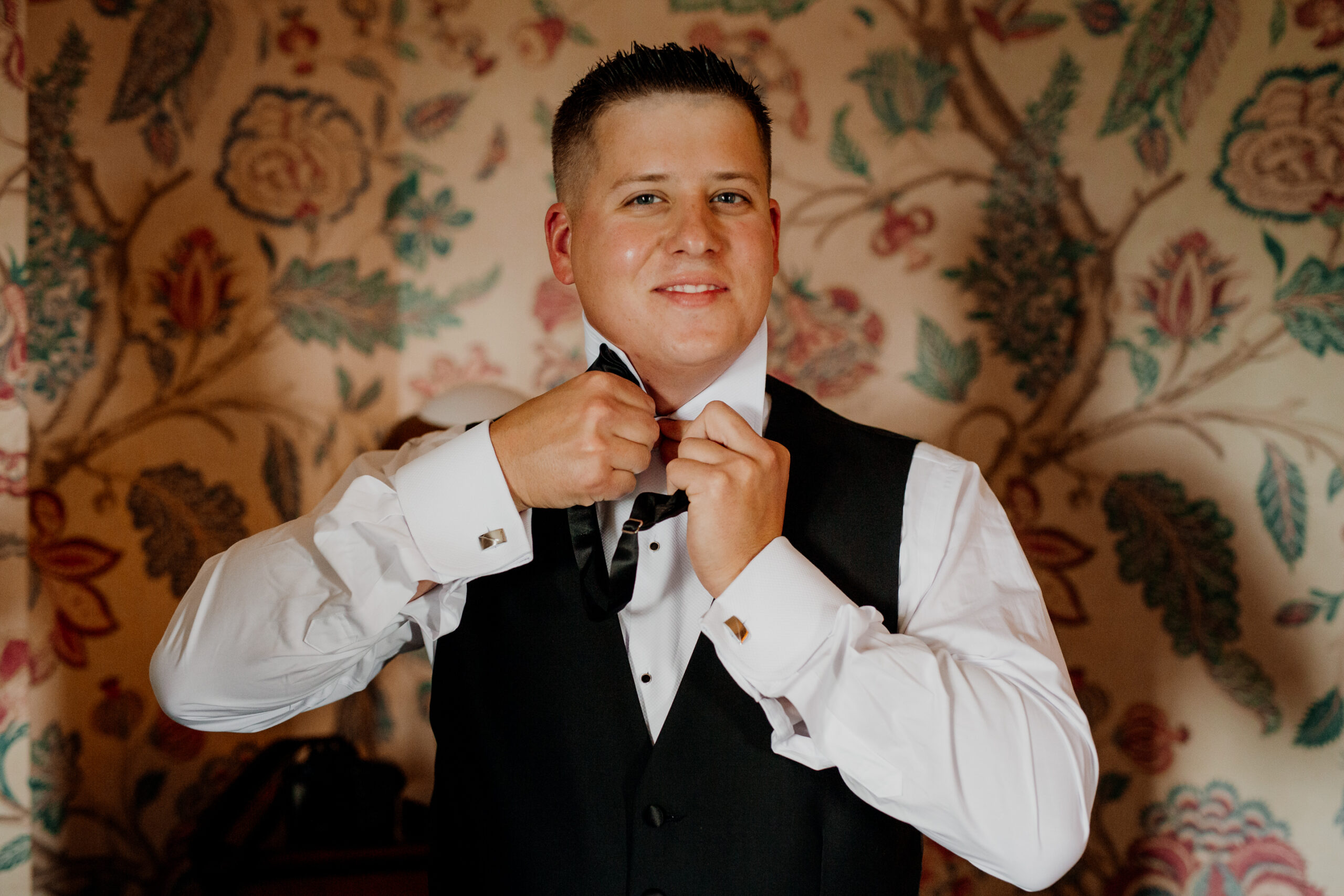 A man adjusting his tie