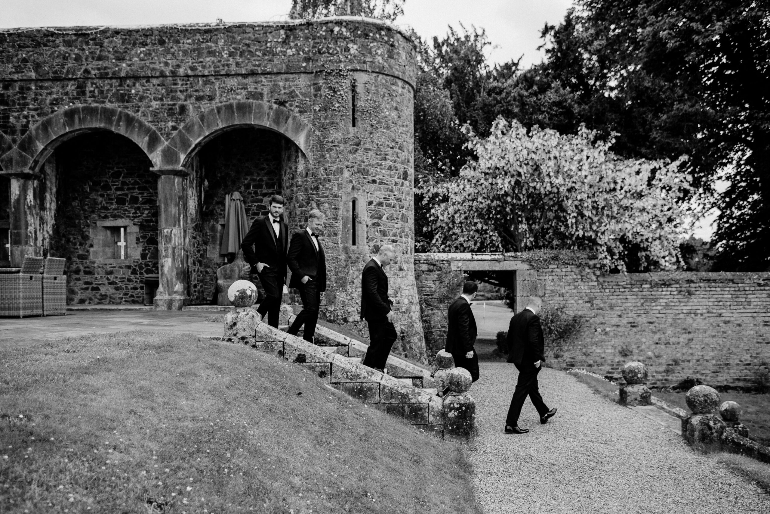 A group of men walking down a stone path