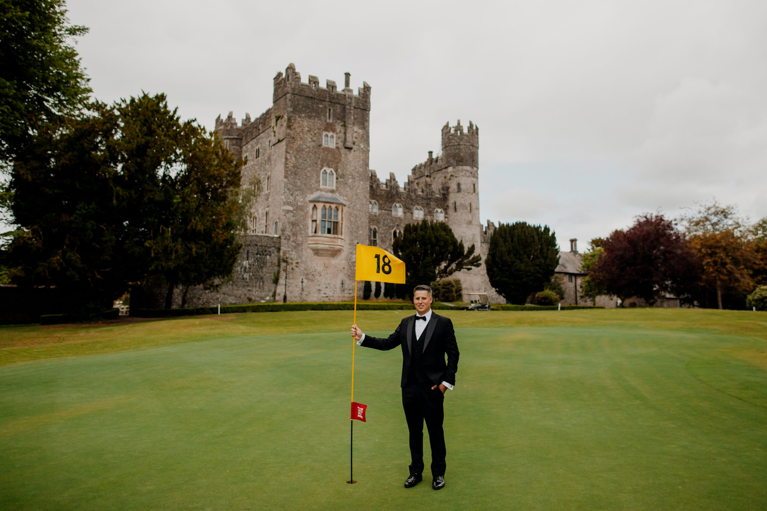 A person standing on a golf course