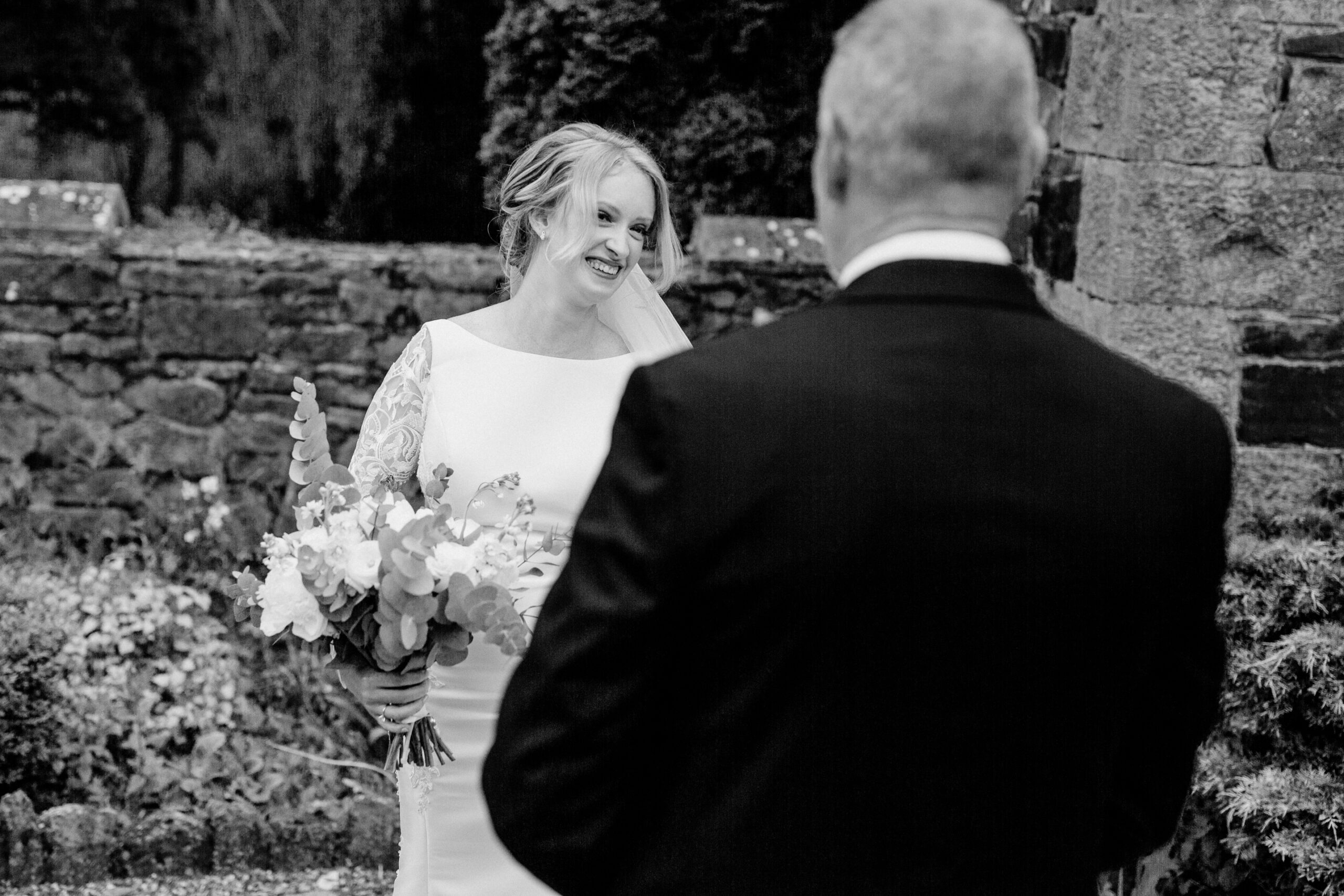 A bride and groom smiling