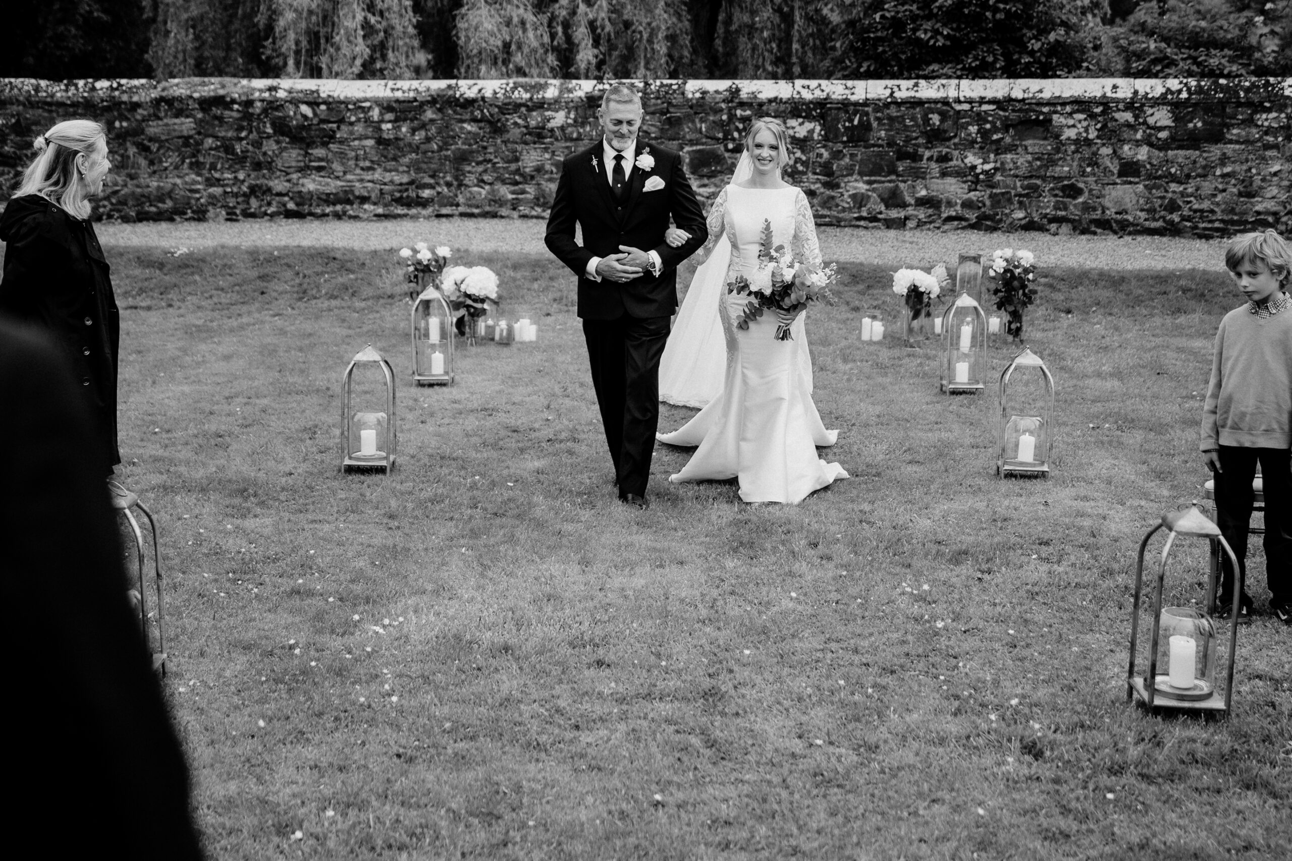 A bride and groom walking down the aisle