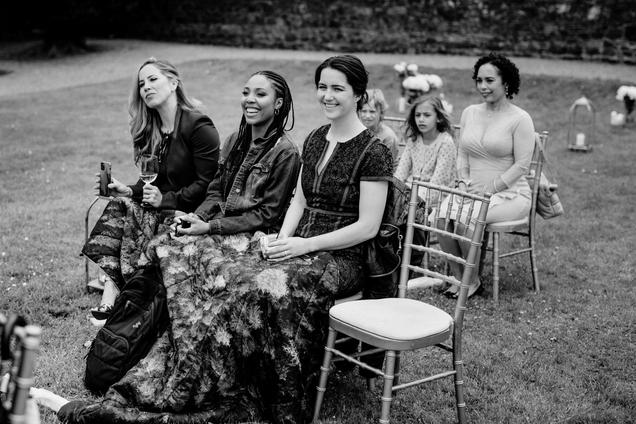 A group of women sitting on chairs