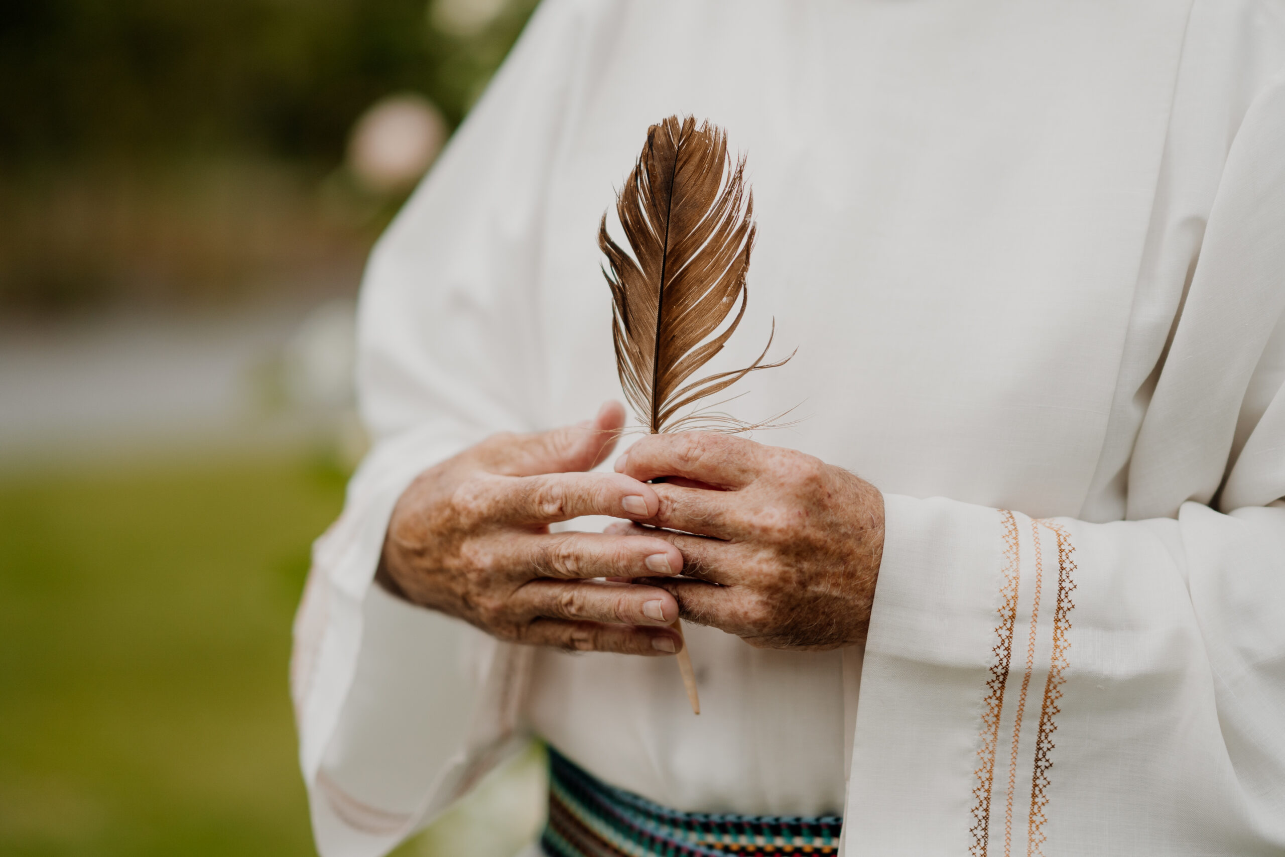 A person holding a pine cone