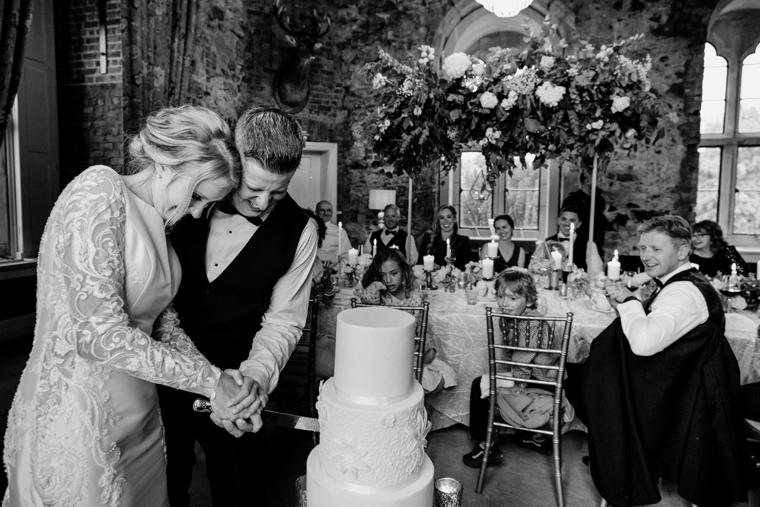 A bride and groom cutting a wedding cake