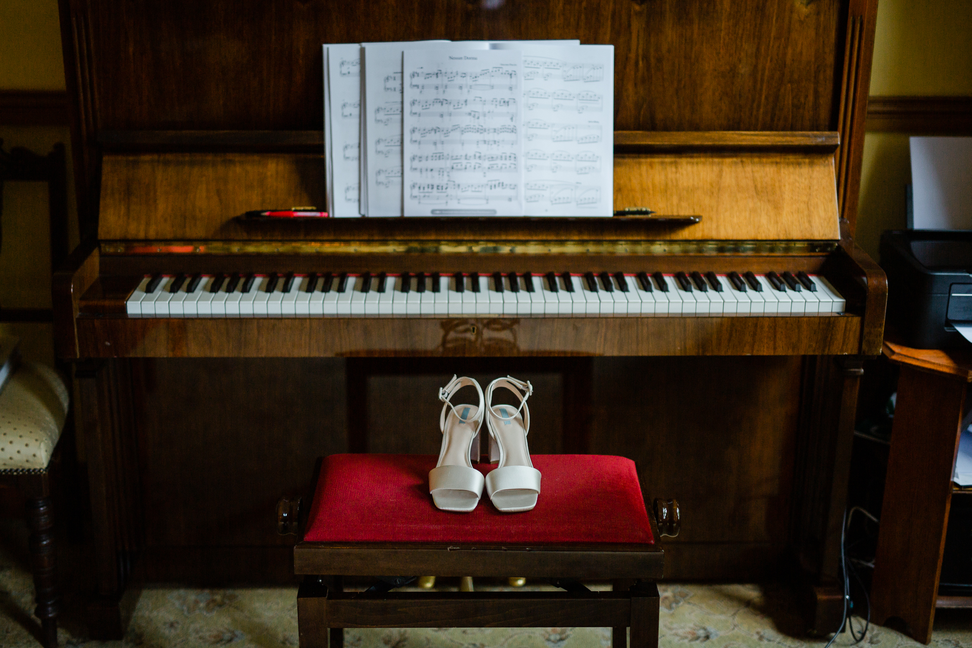 A piano with a white sheet on it