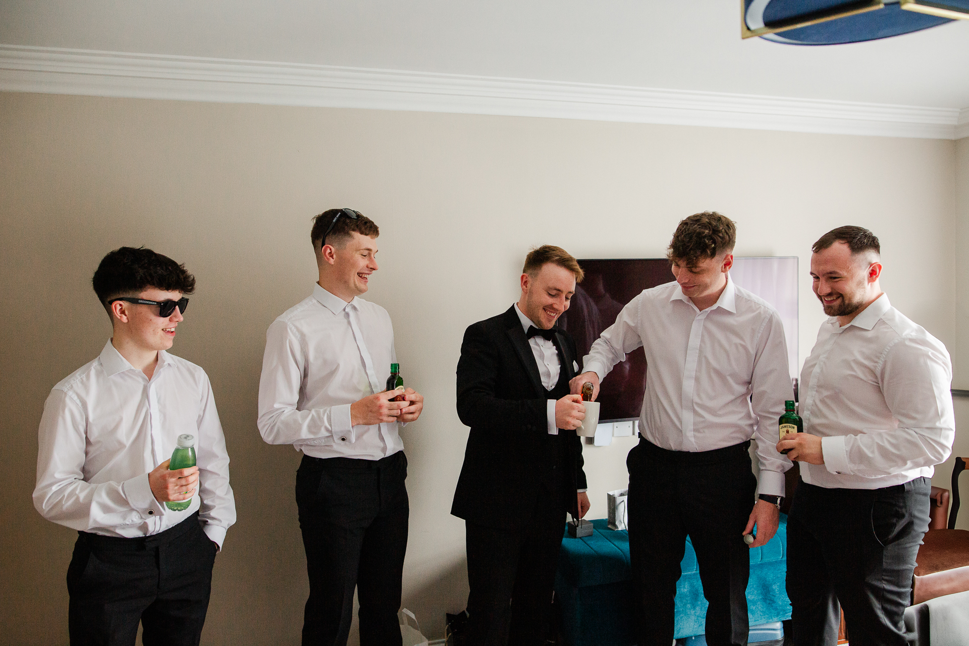 A group of men holding drinks