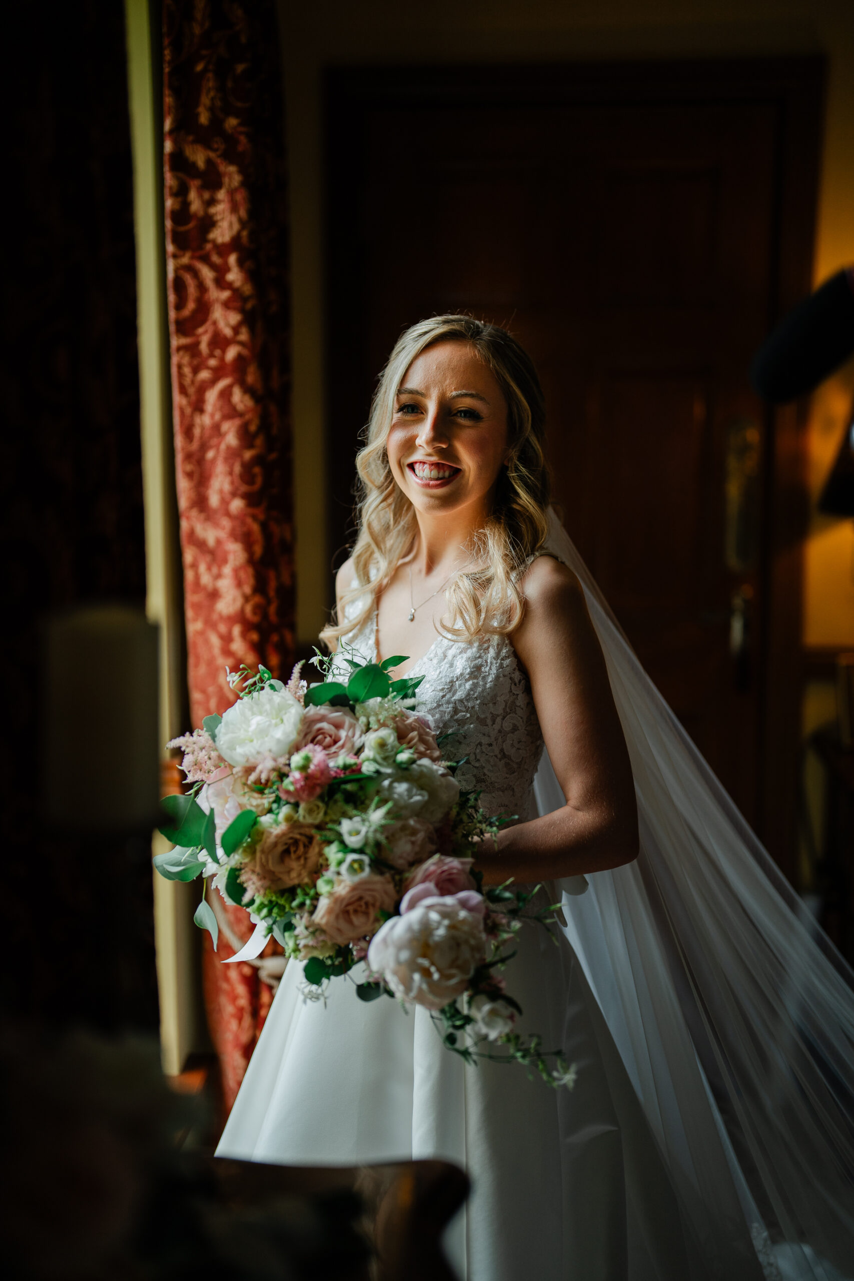 A woman in a white dress holding a bouquet of flowers