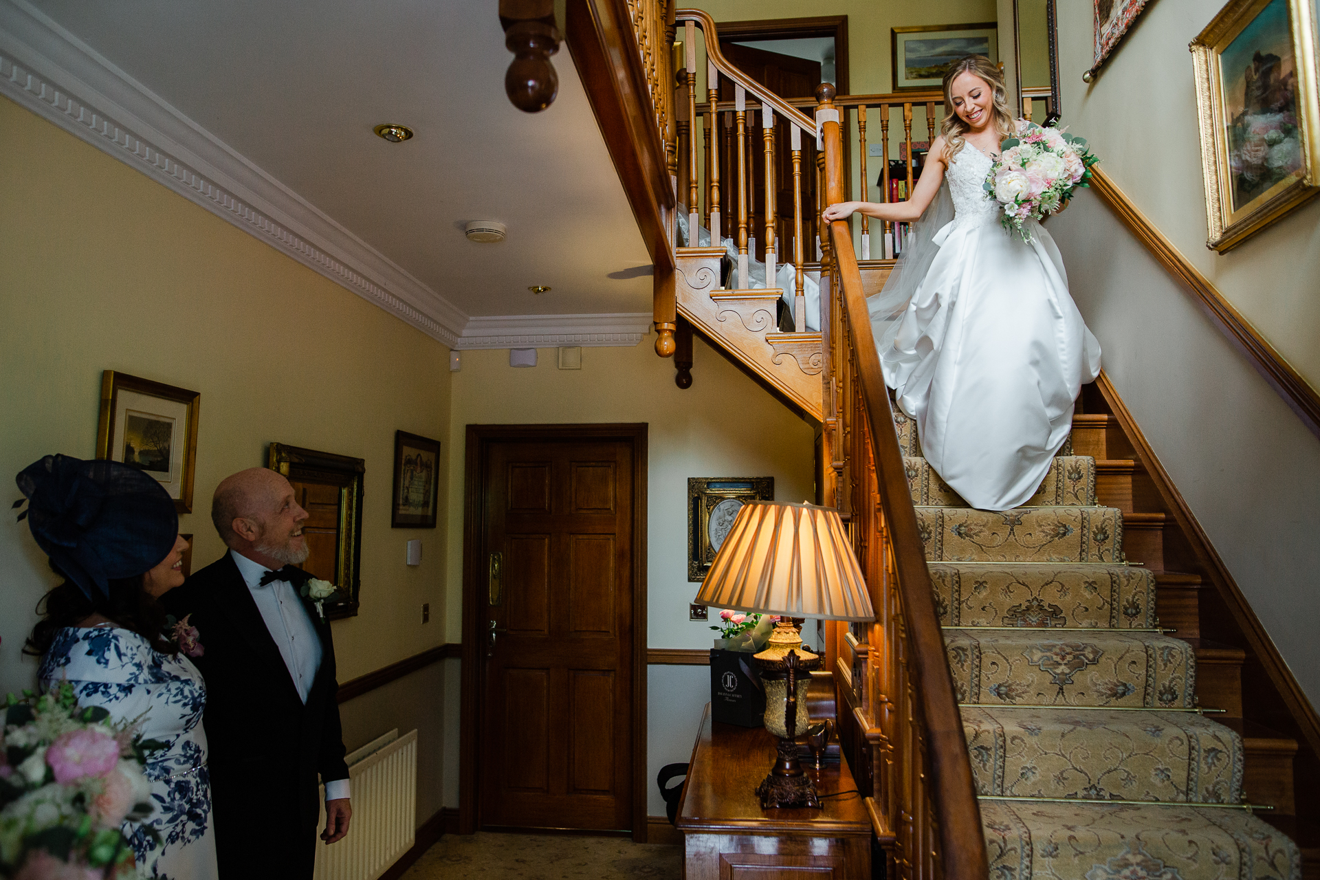 A bride and groom on stairs