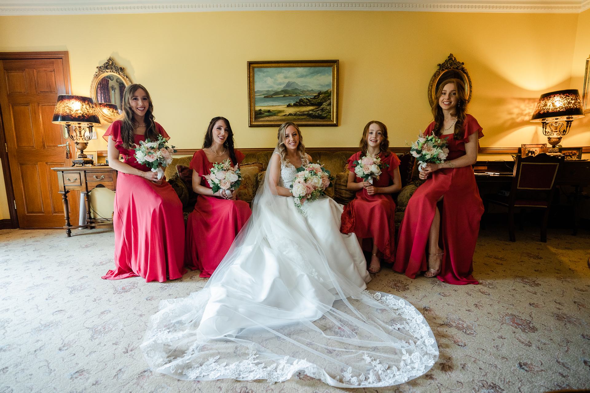 A group of women in dresses posing for a photo