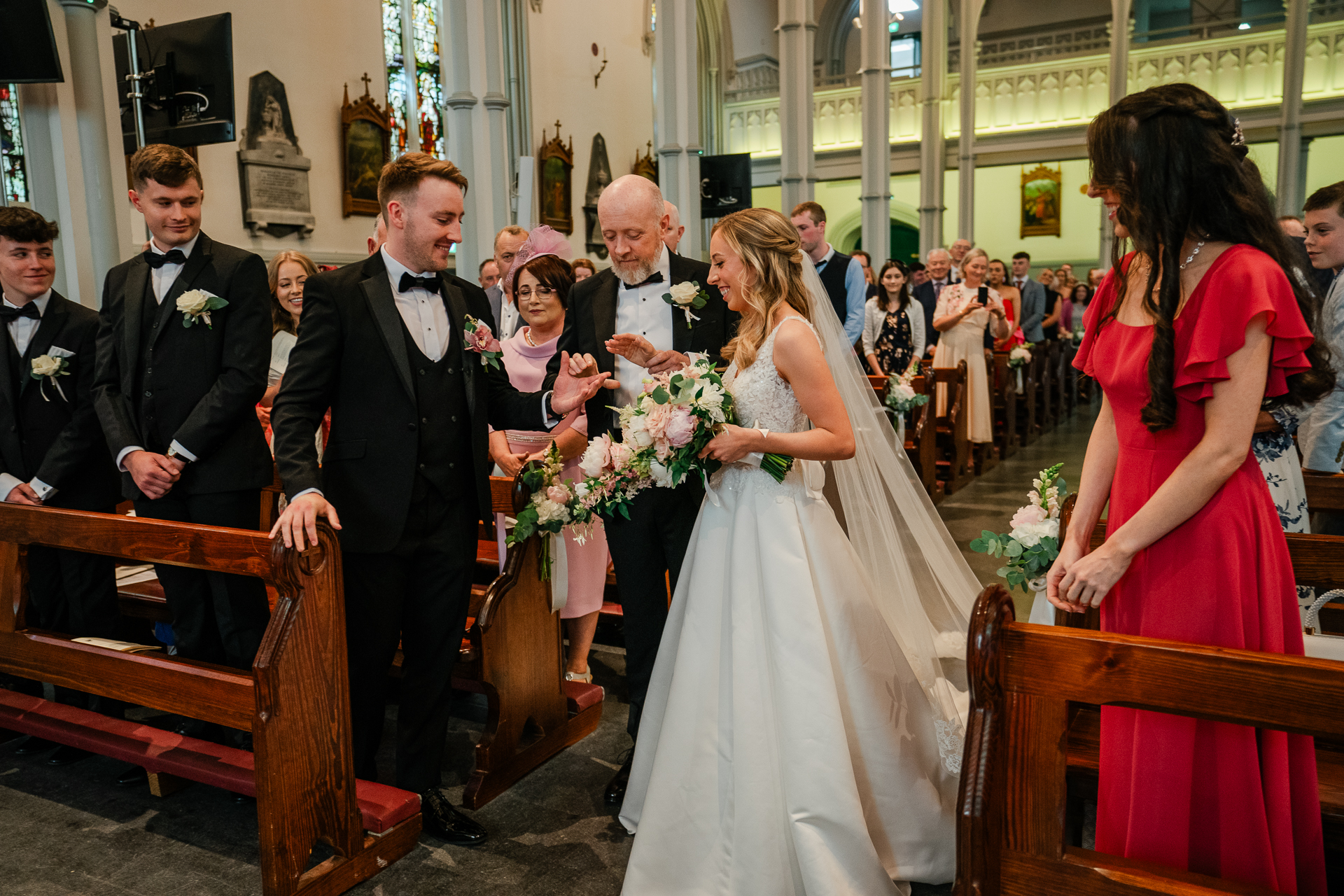 A bride and groom walking down the aisle