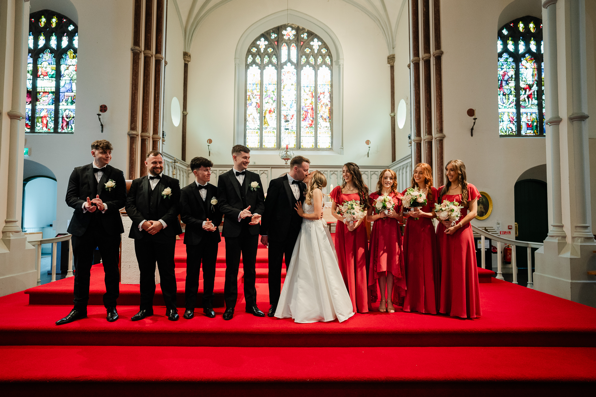 A group of people posing for a photo in a church