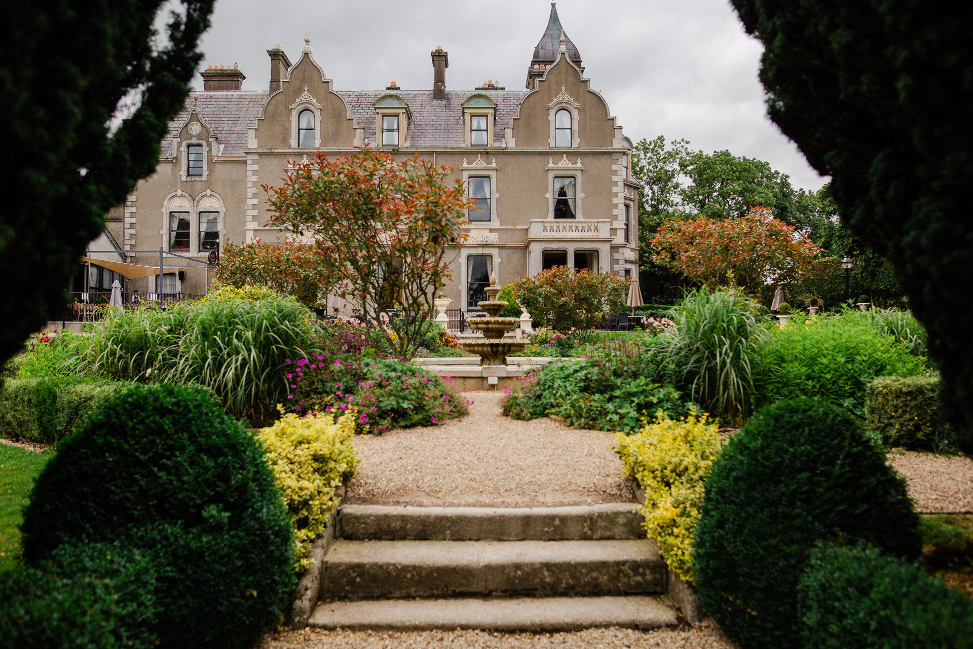 A large building with a garden in front of it