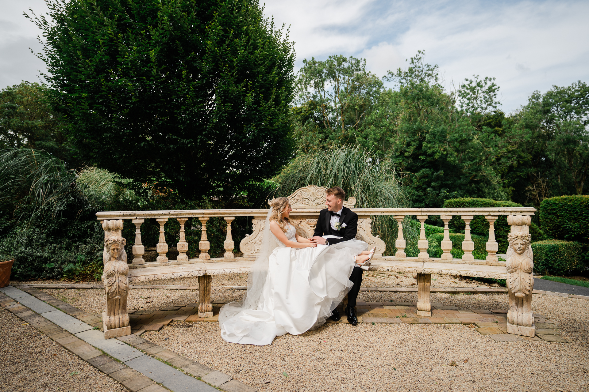 A man and woman sitting on a bench