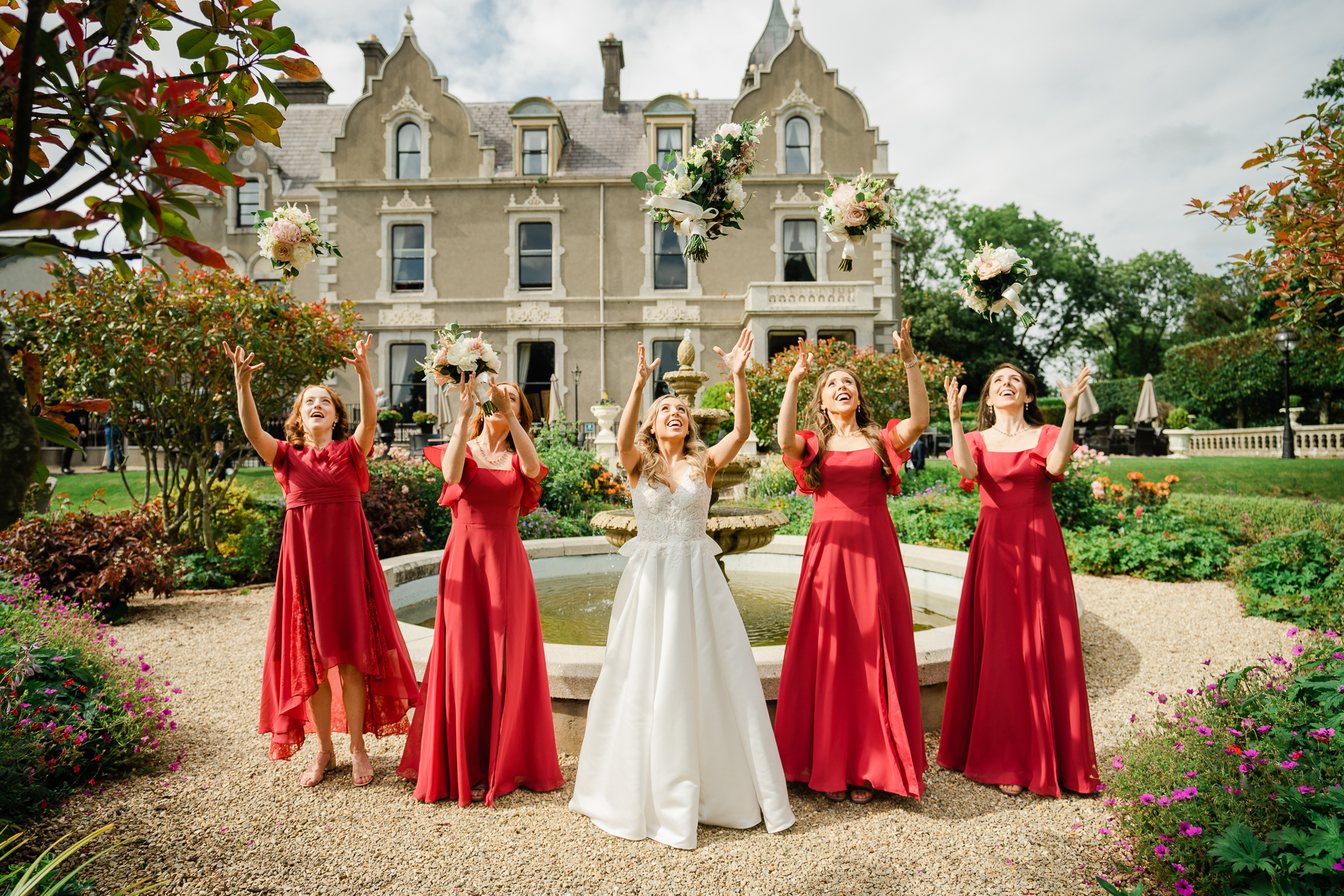 A group of women in dresses posing for a photo