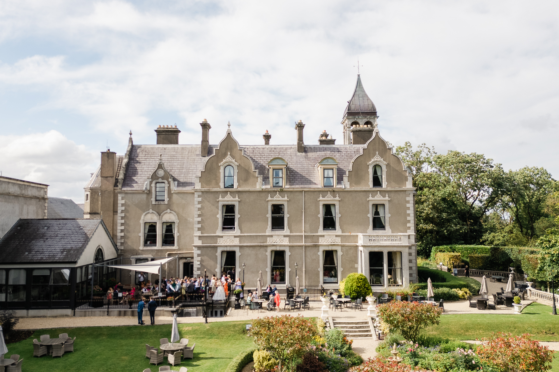 A large building with a garden in front of it