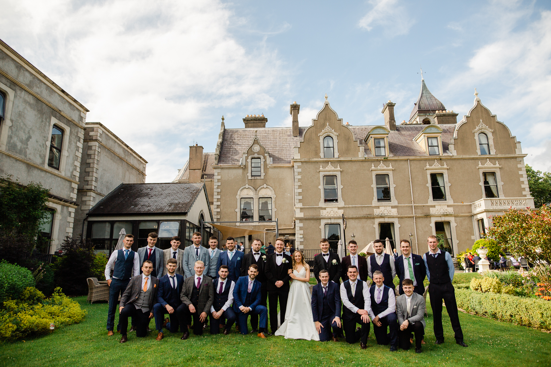 A group of people posing for a photo in front of a building