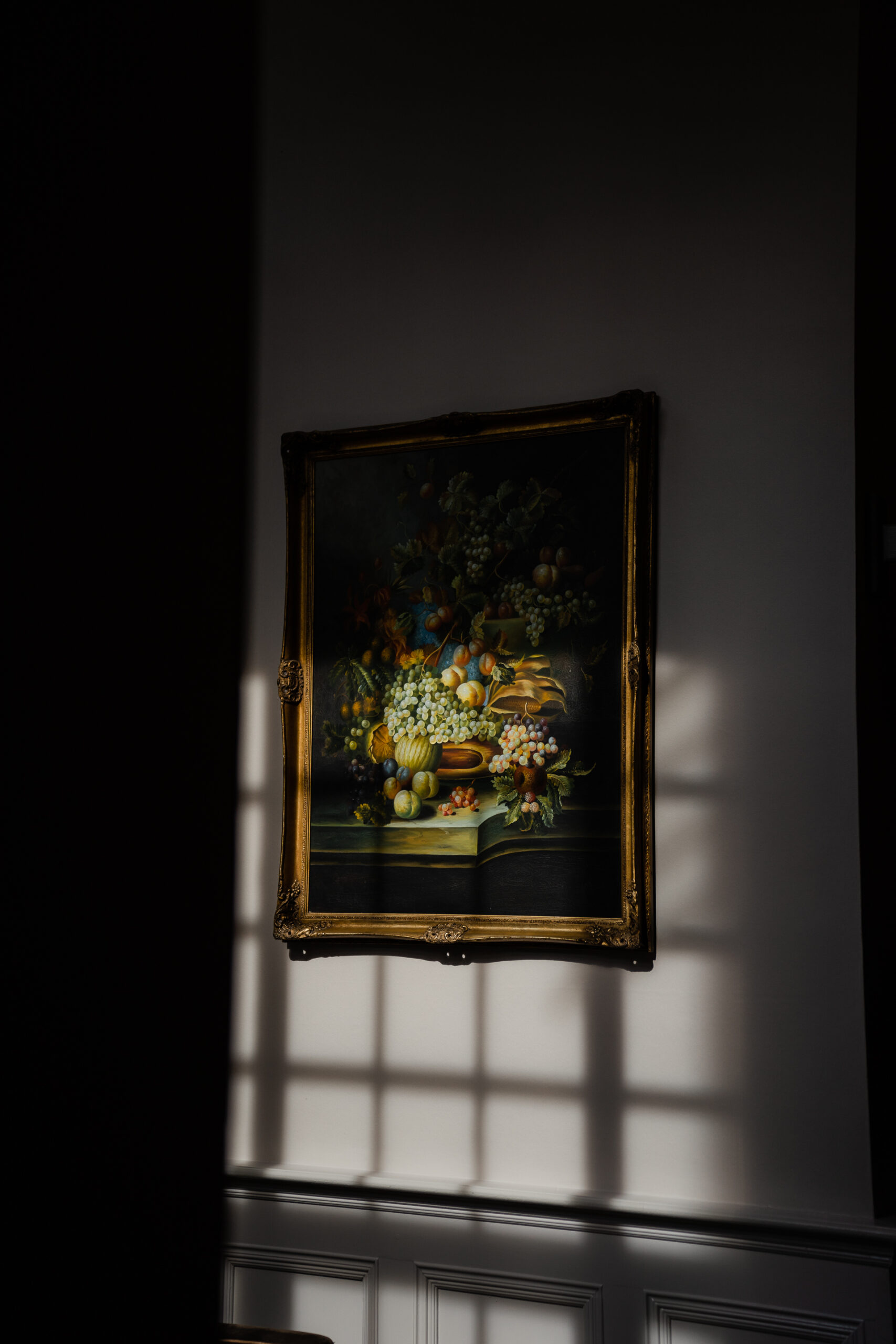 A framed painting on a wall