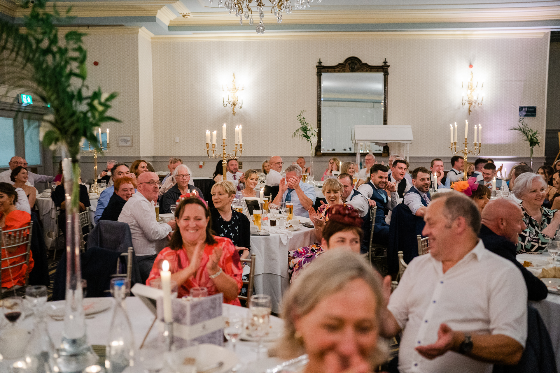 A large group of people sitting at tables