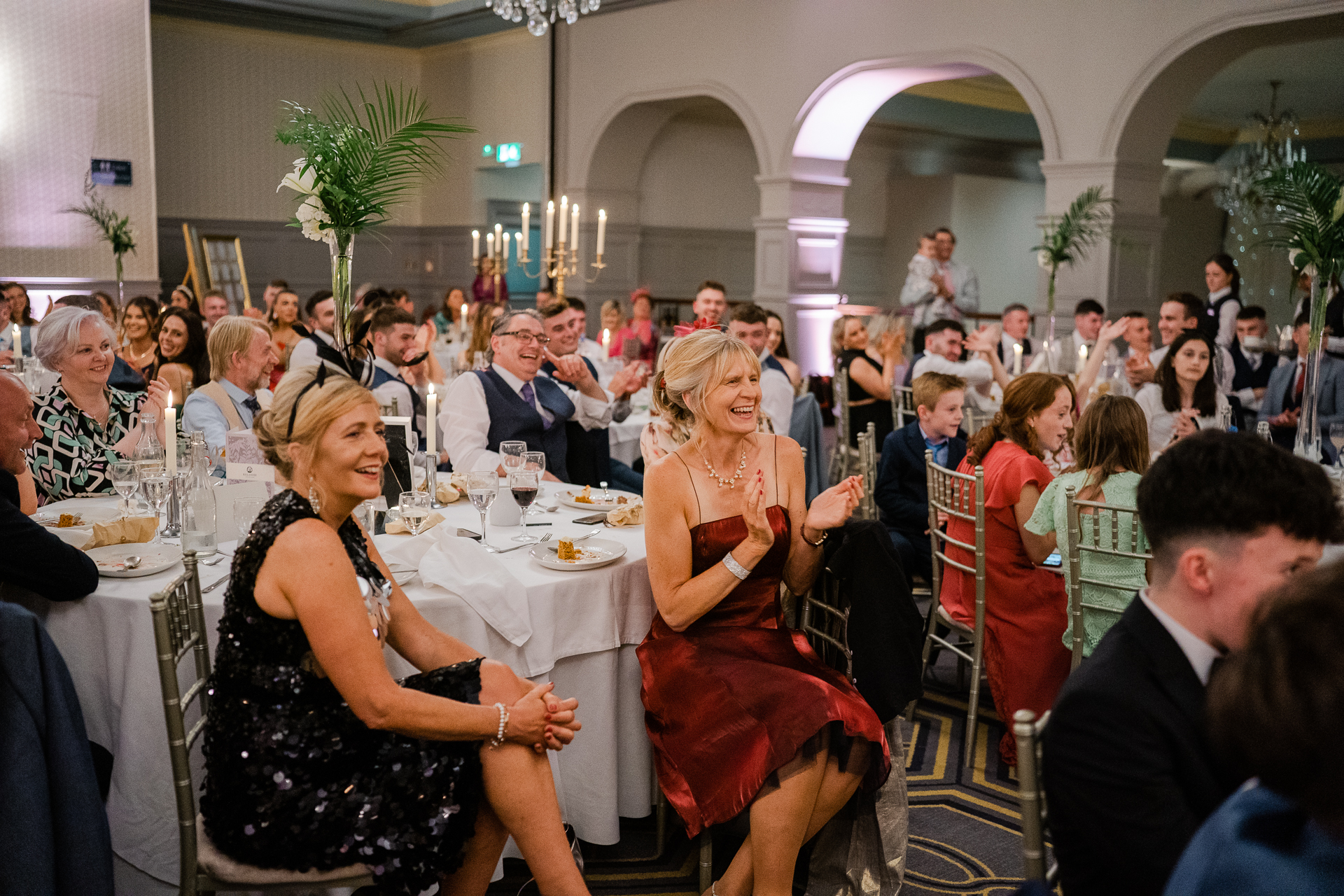 A group of people sitting at tables