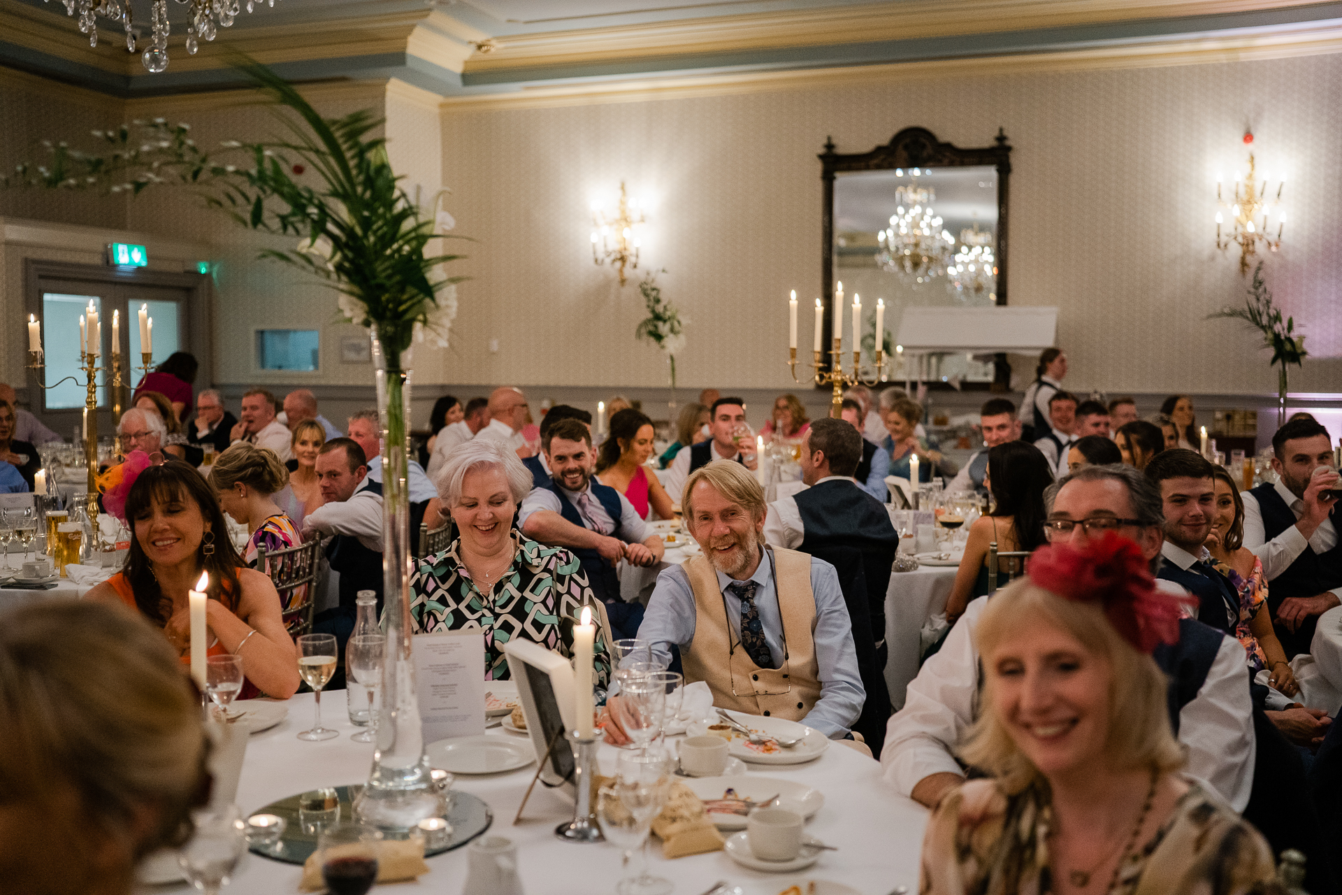 A large group of people sitting at a dinner table