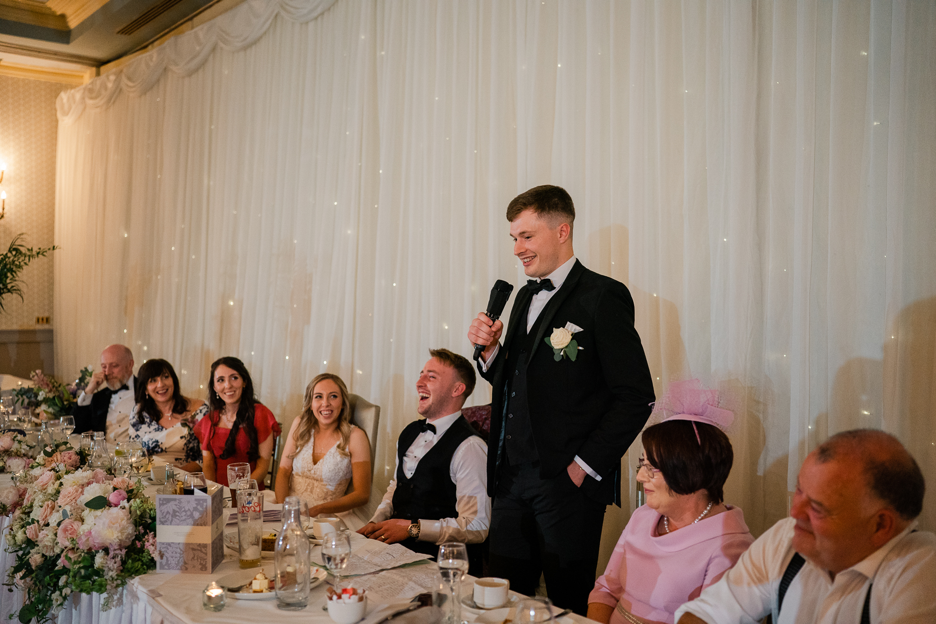 A man in a tuxedo and a woman in a dress