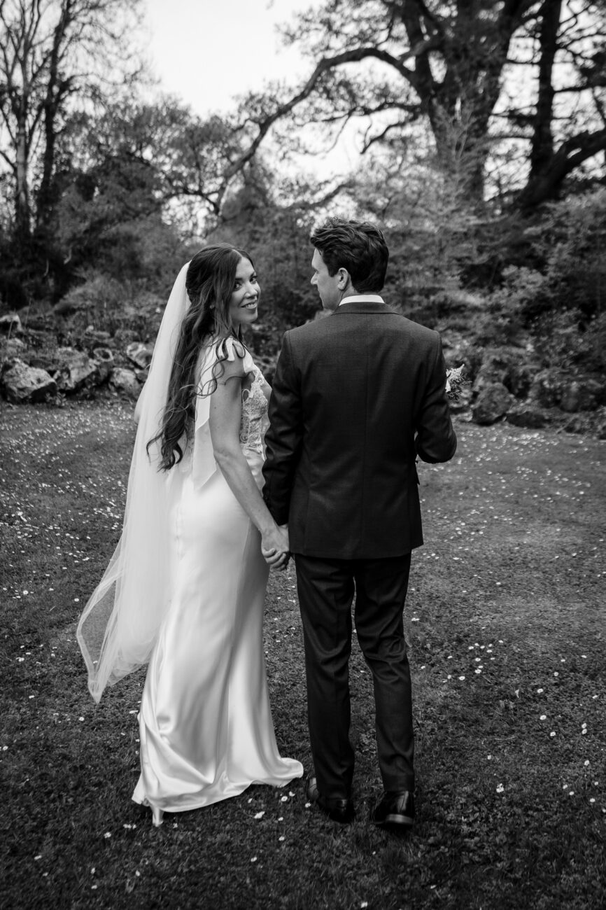 A man and woman walking down a path