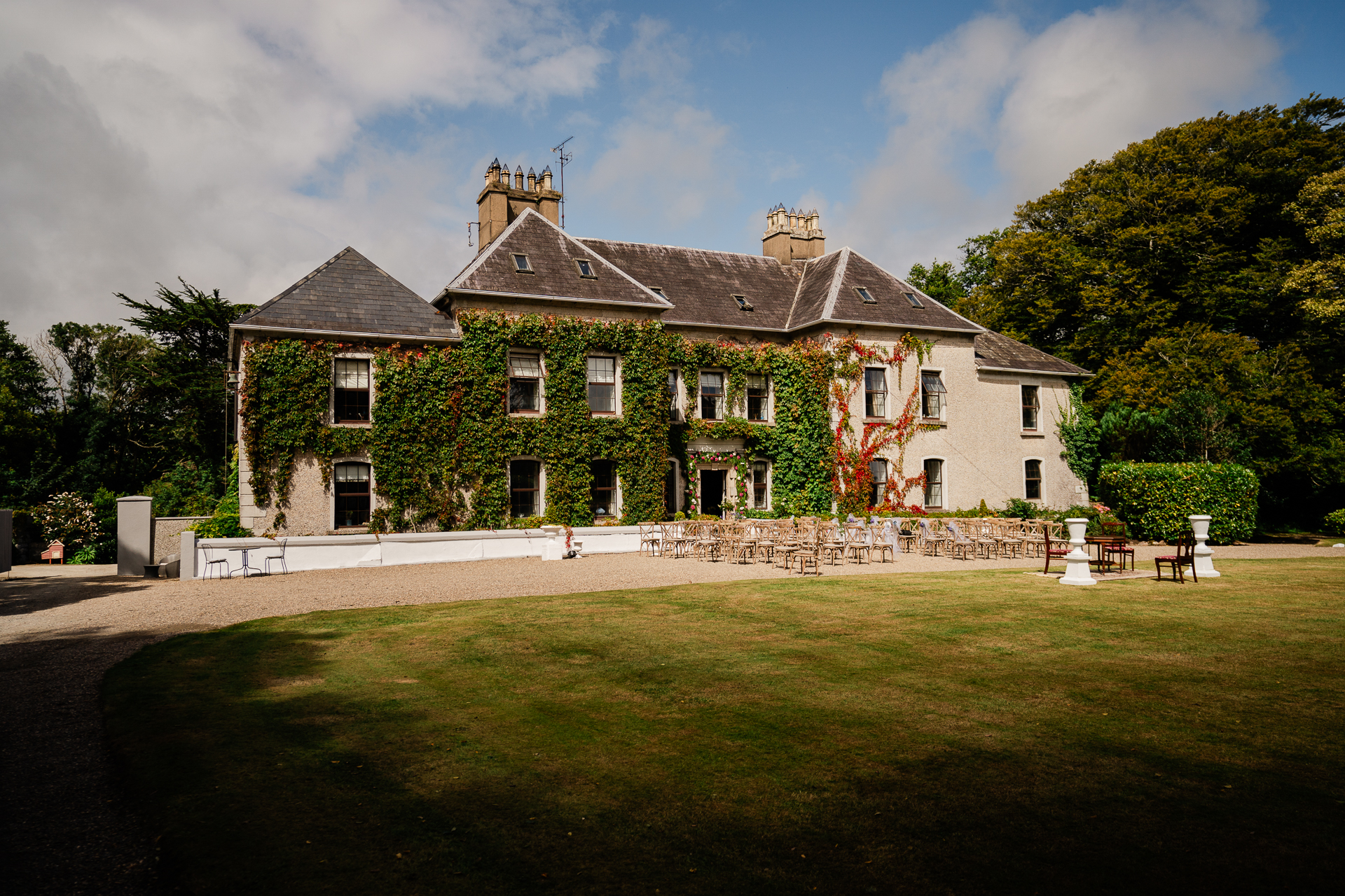 A large house with a lawn in front of it