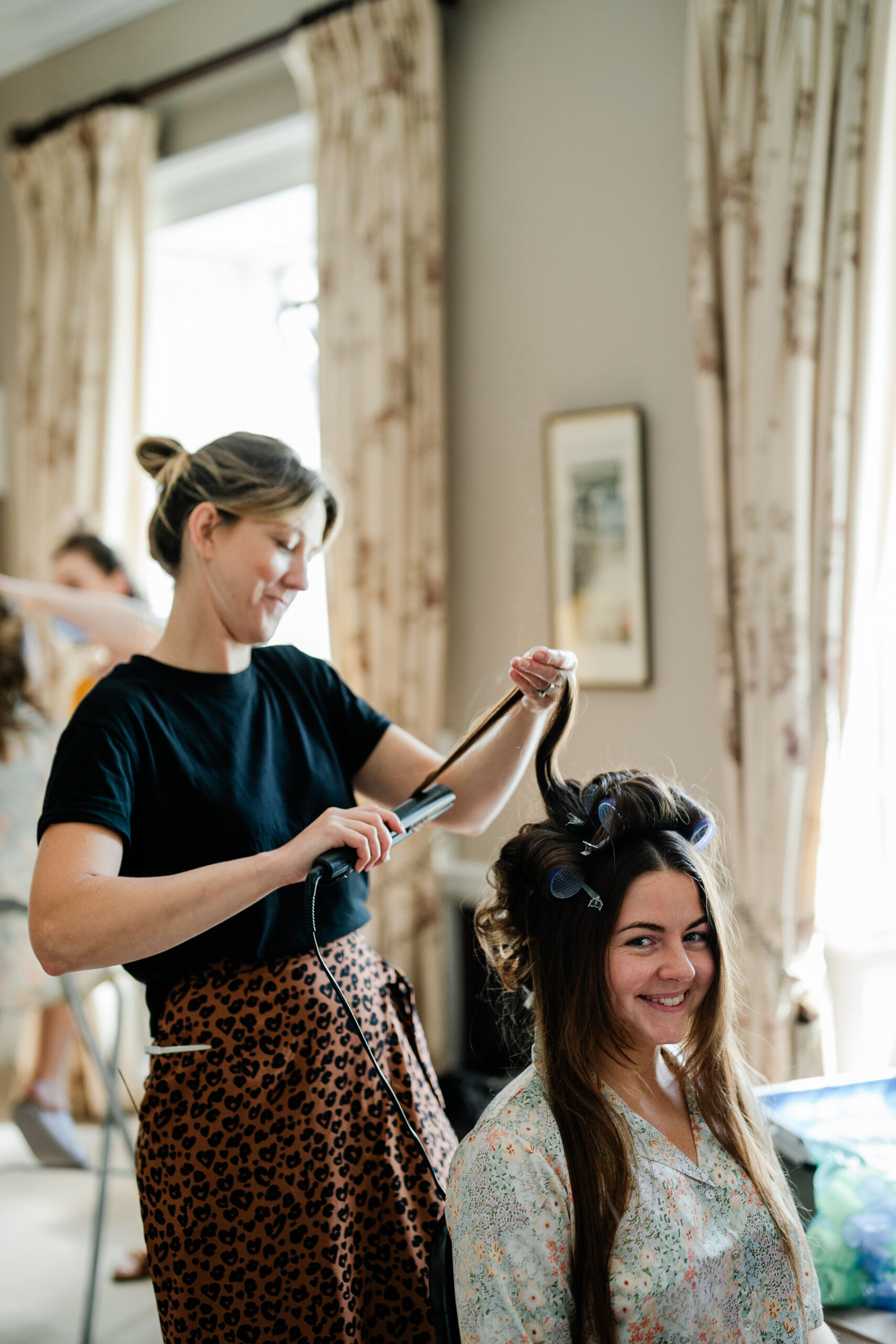 A person cutting another woman's hair