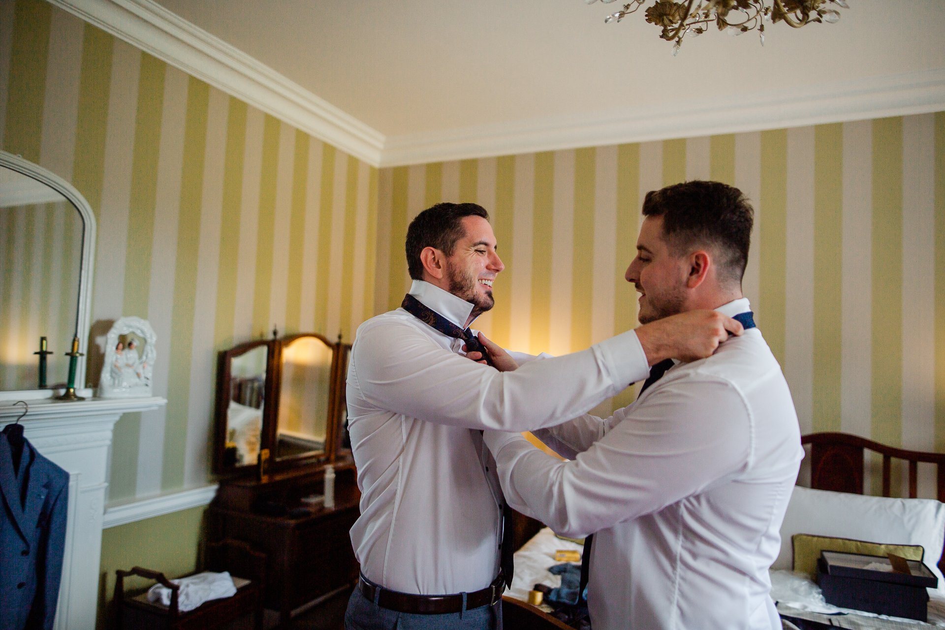 A man tying his tie