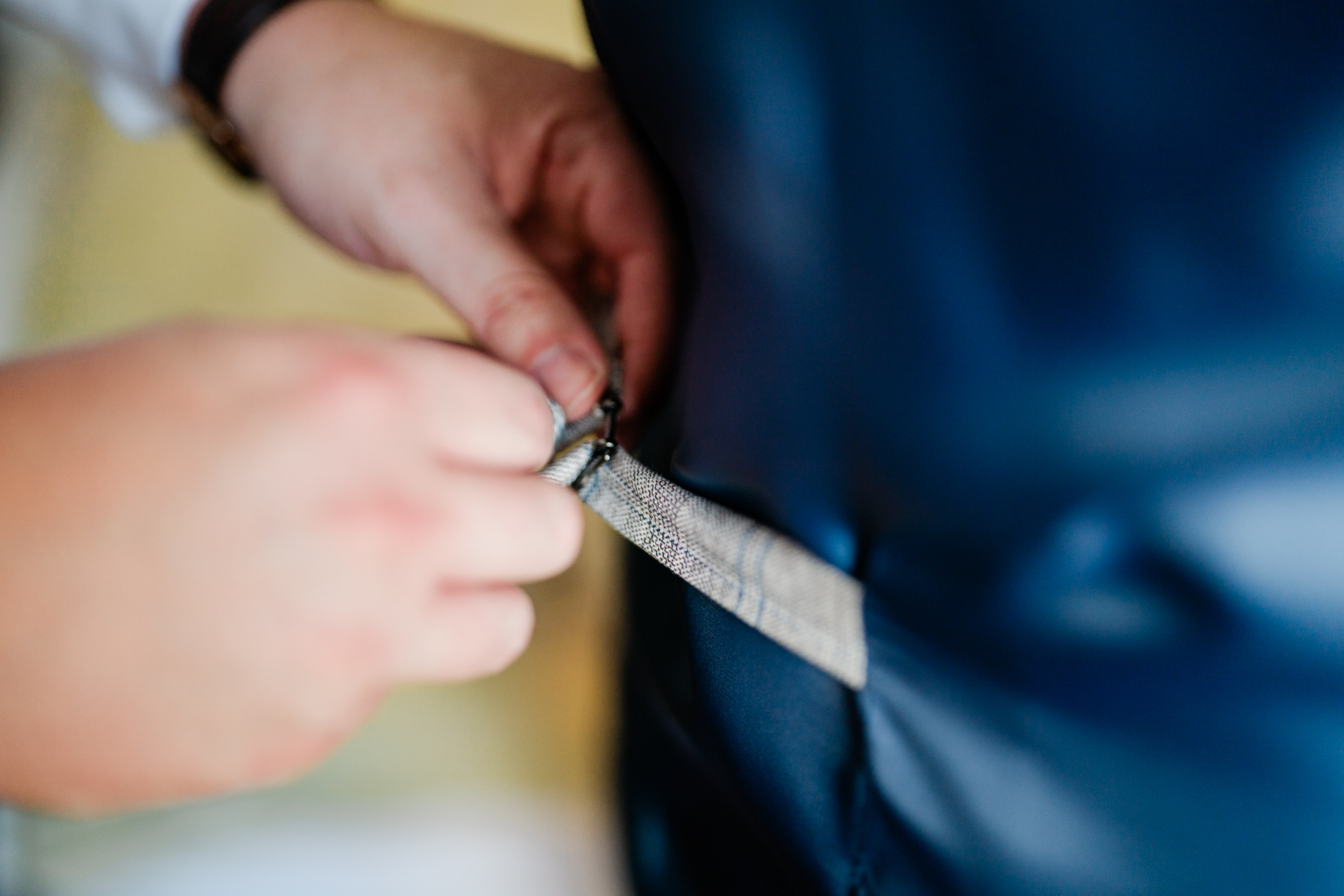 A person cutting a piece of fabric