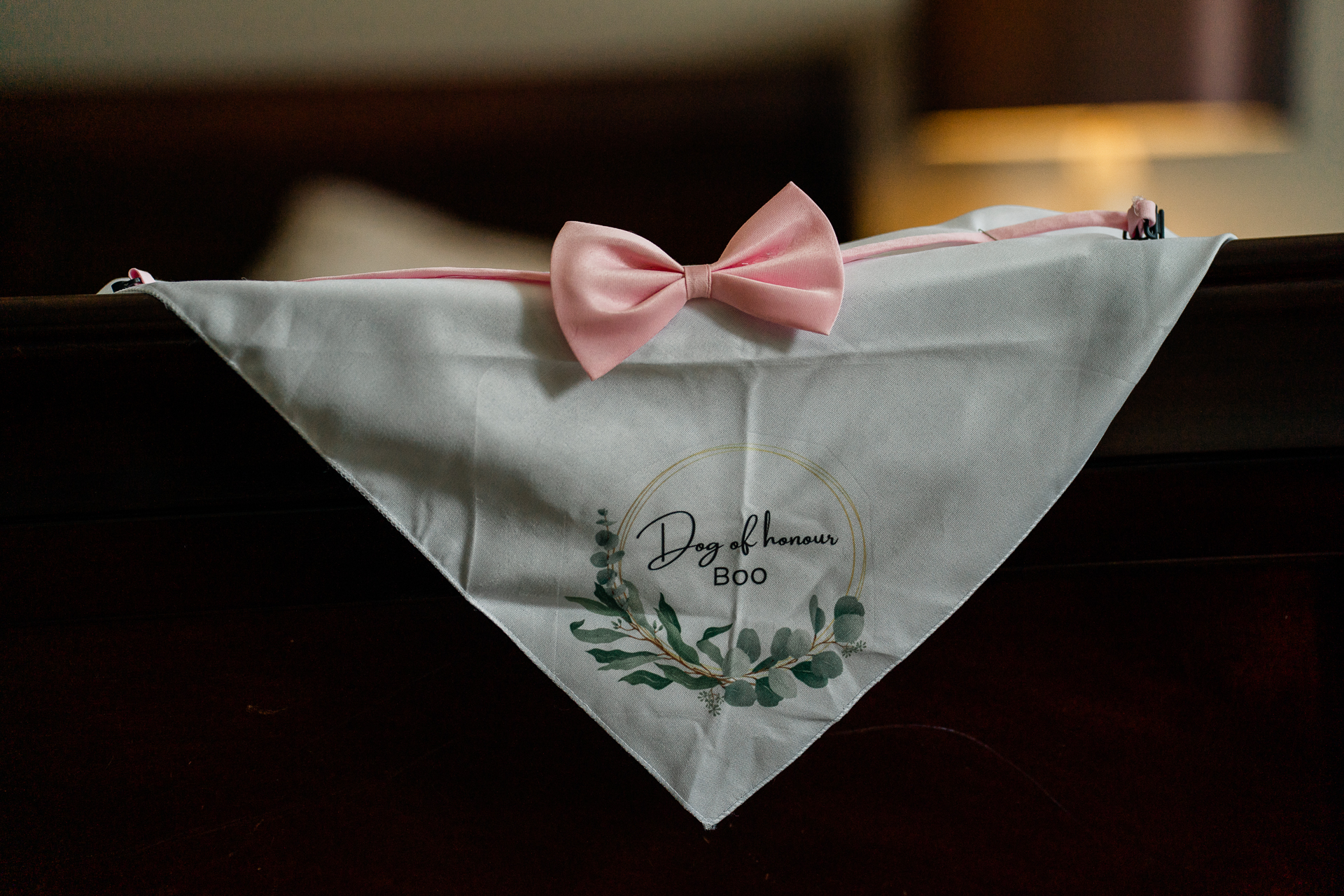 A white napkin with pink roses on it