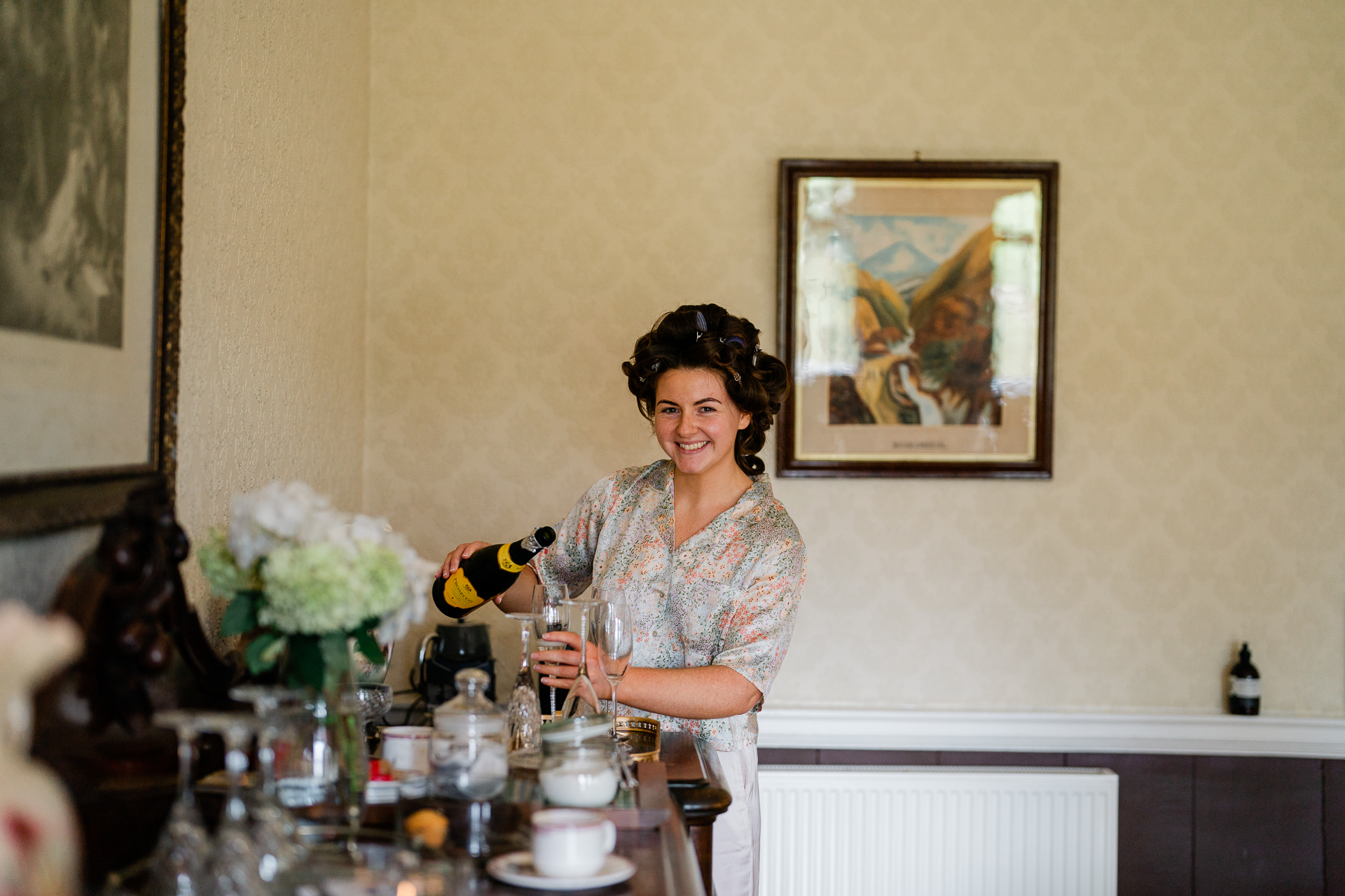 A person pouring wine into a glass