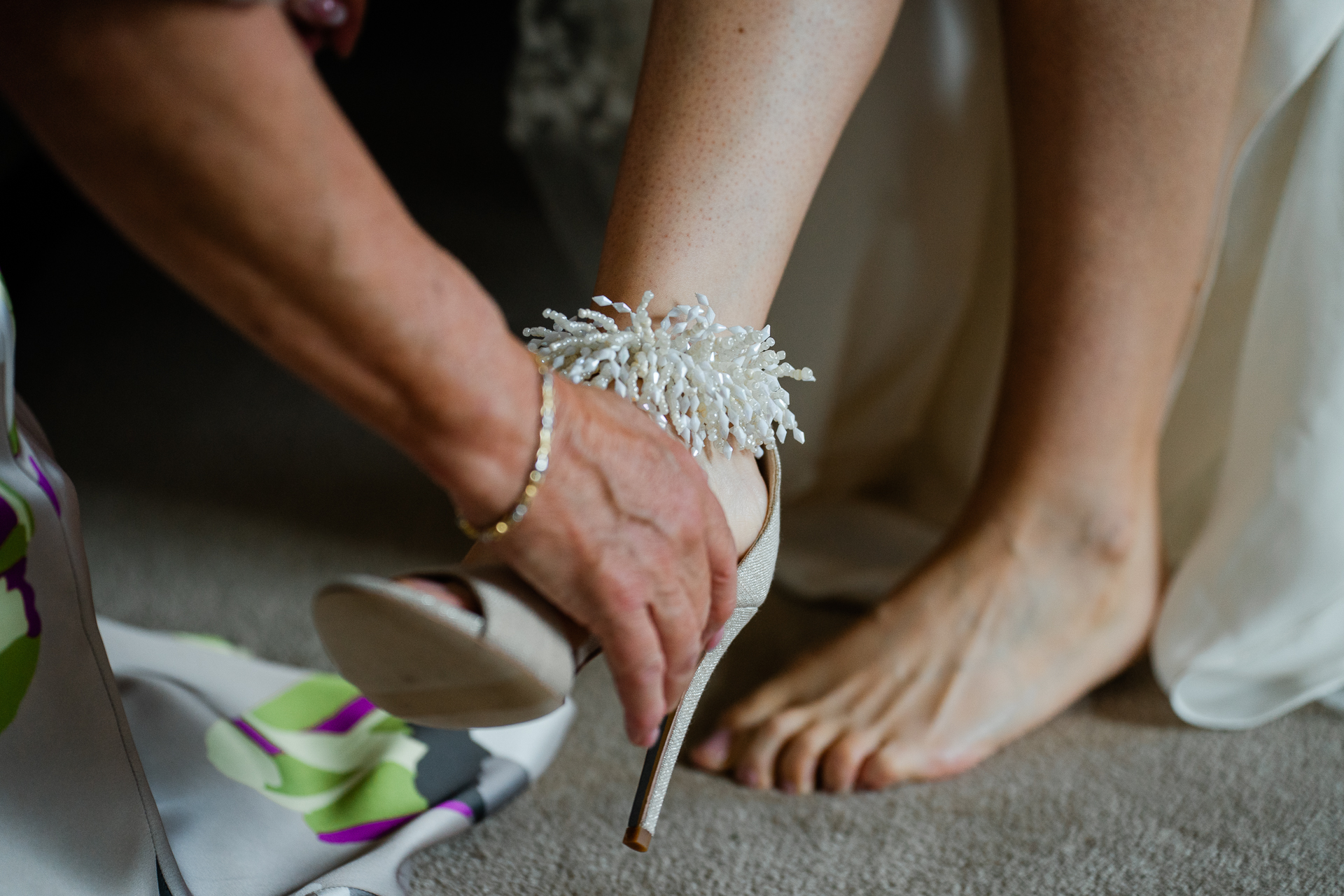 A pair of feet with bracelets