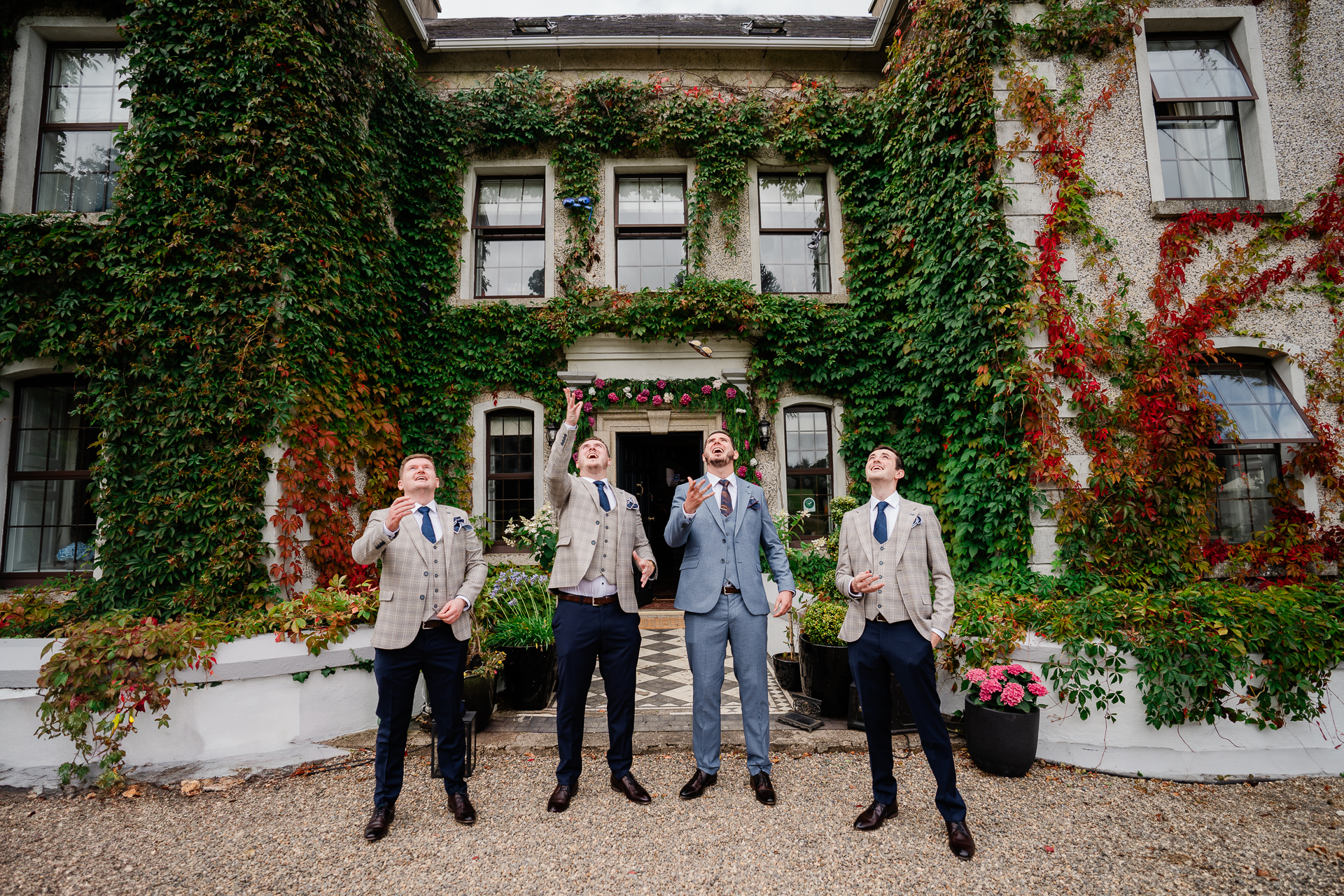 A group of men standing in front of a building