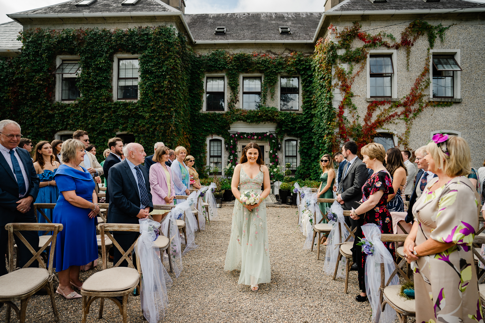 A bride and groom walking down the aisle